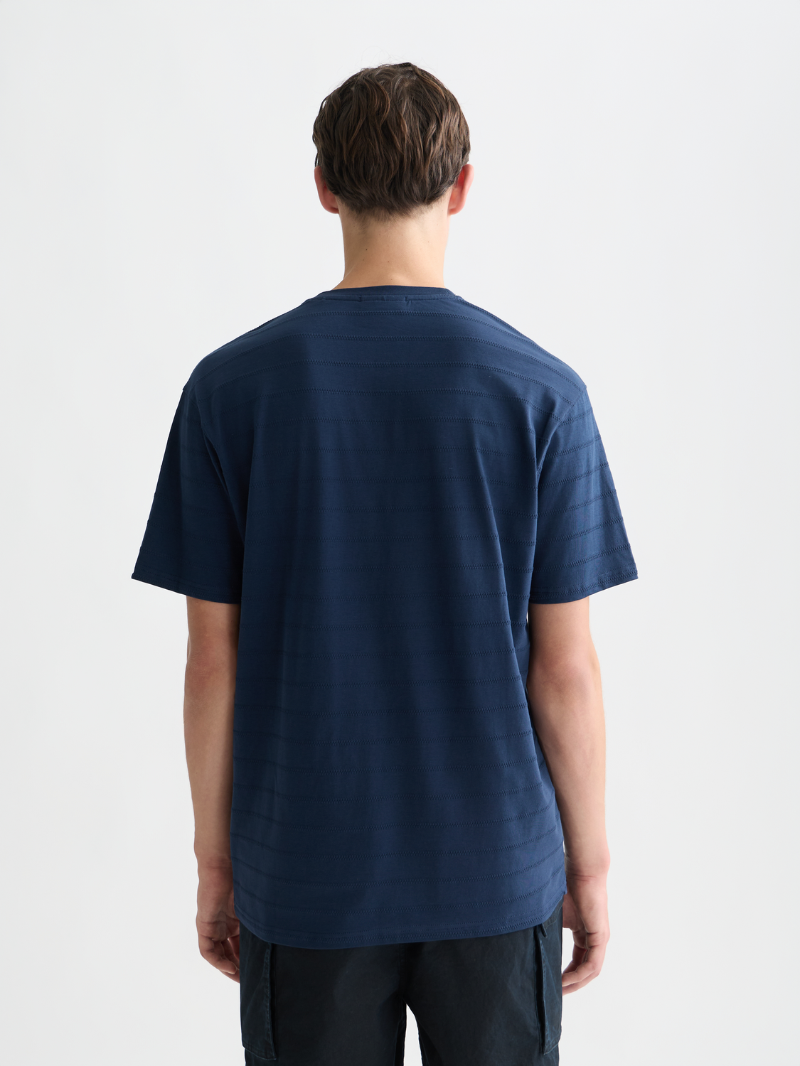 Scott & Soda jacquard short-sleeve T-shirt with intricate woven pattern, displayed from the back view.