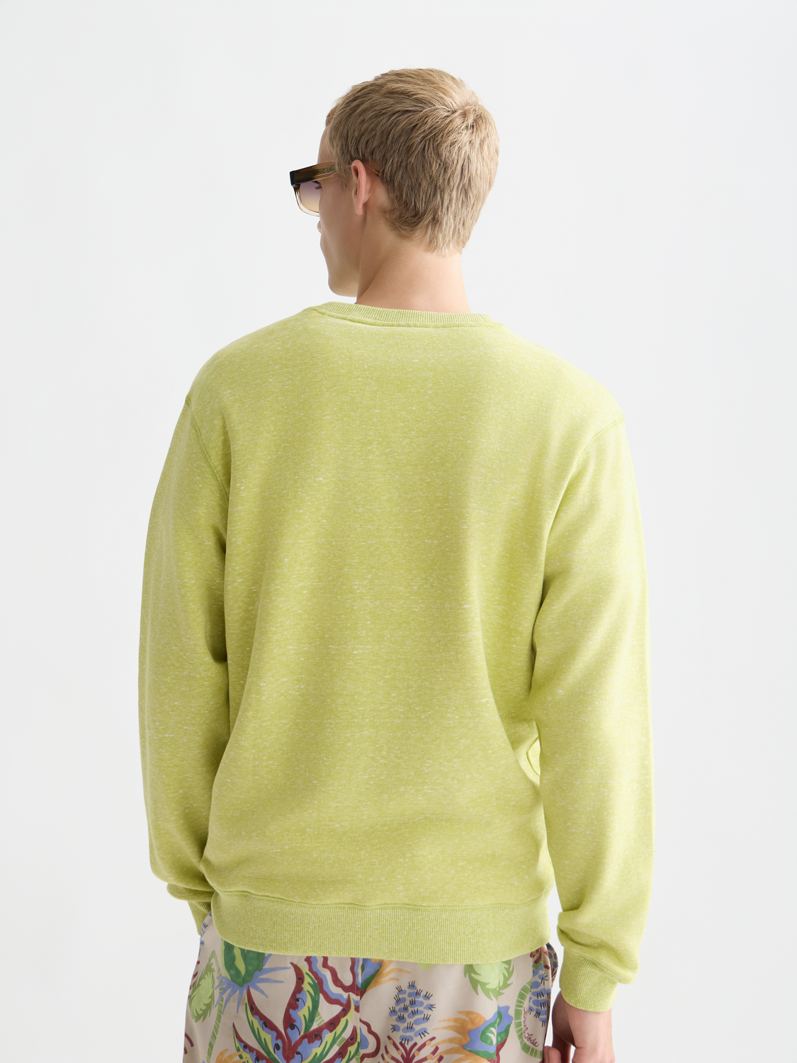 SCOTCH & SODA melange sweatshirt with soft fabric, featuring a relaxed fit and ribbed cuffs, shown from the back.