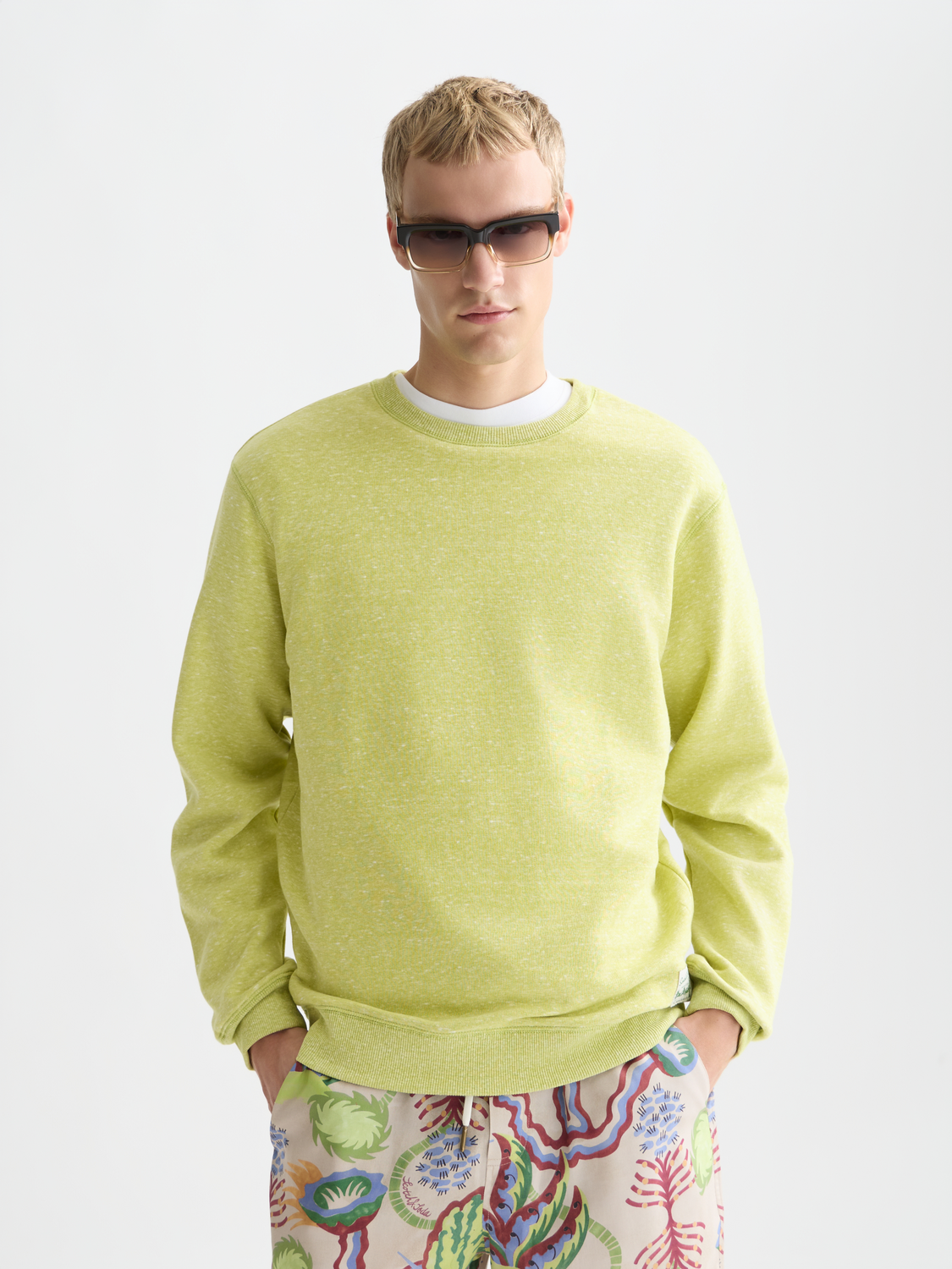 Scotch & Soda melange sweatshirt with a cozy knit texture, featuring a relaxed fit and classic crewneck style.