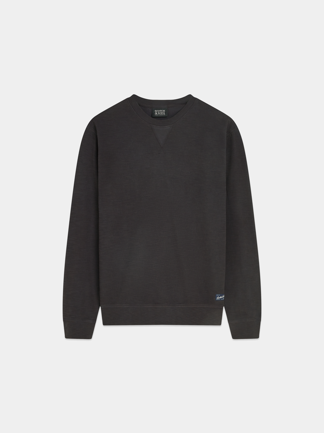 Garment-dyed sweatshirt from Scotch & Soda, soft cotton sweats with a relaxed fit, shown in a vibrant color.