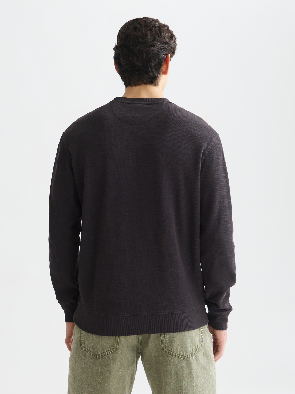 Garment-dyed Scotch & Soda sweatshirt in soft fabric, shown from the back with a relaxed fit and subtle stitching details.