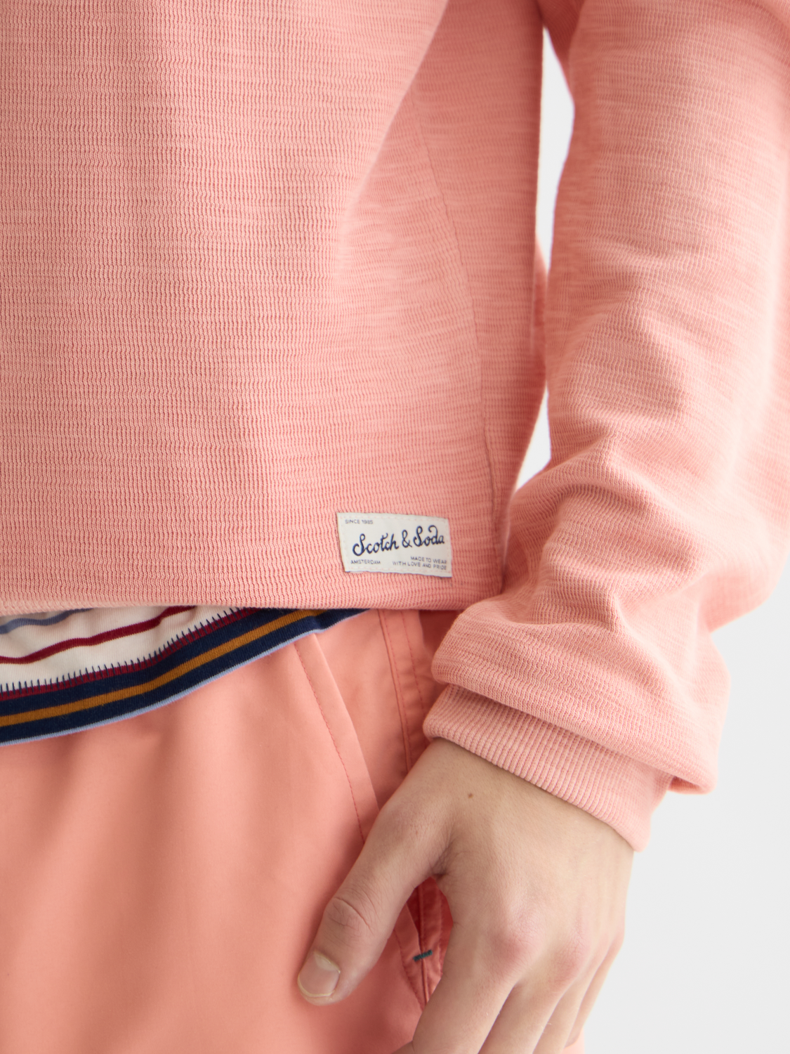 Garment-dyed Scotch & Soda sweatshirt in soft fabric, showing a close-up of the textured, casual sweats style.