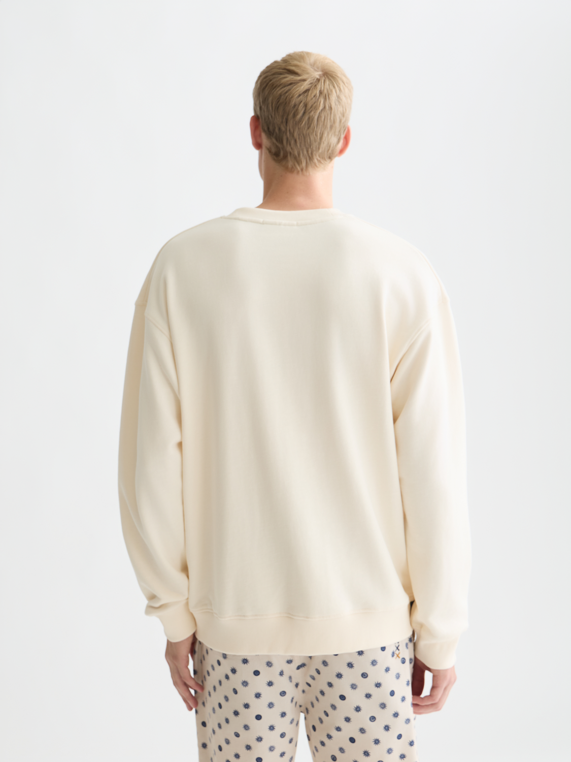 Embroidered Scotch & Soda sweatshirt with detailed stitching, cozy fit, and casual style, shown from the back.