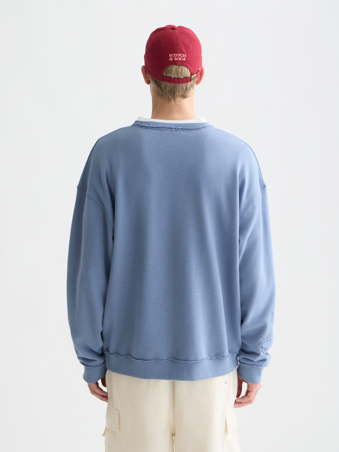 Embossed sweatshirt from Scotch & Soda with embroidered design, showing the back view of the casual sweats.
