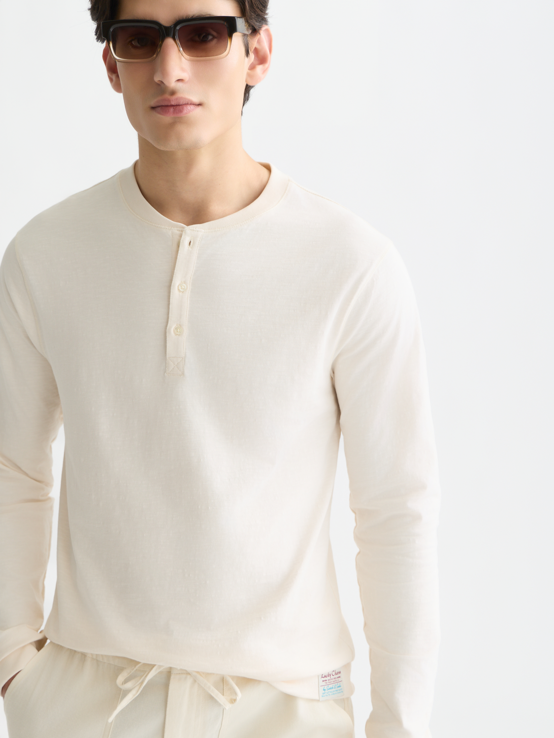 Long sleeve Scotch & Soda Slub Henley T-shirt in a casual, textured fabric with a buttoned neckline and relaxed fit.