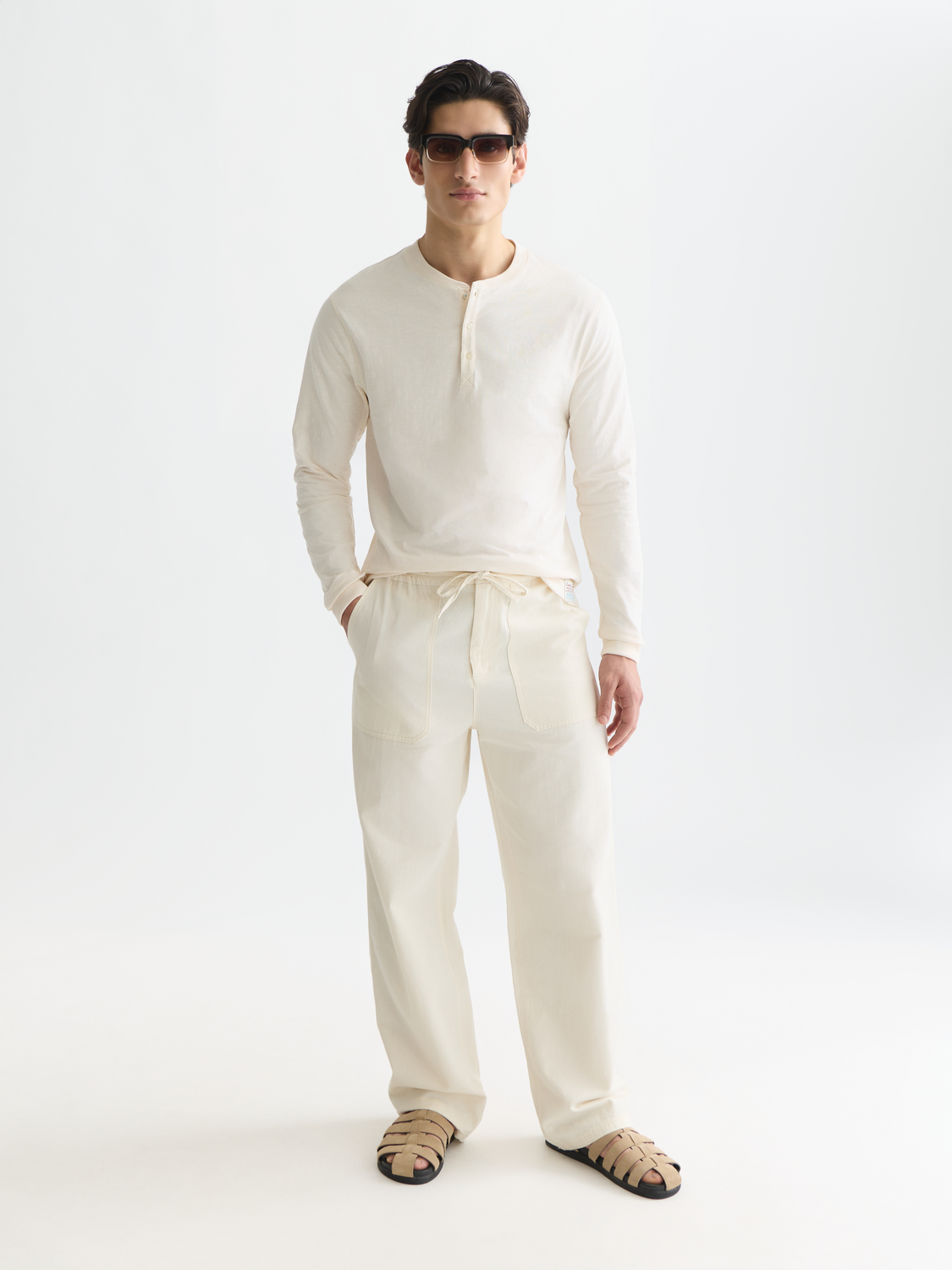 Long sleeve Scotch & Soda Slub Henley t-shirt in a natural fabric with a buttoned neckline and textured appearance.