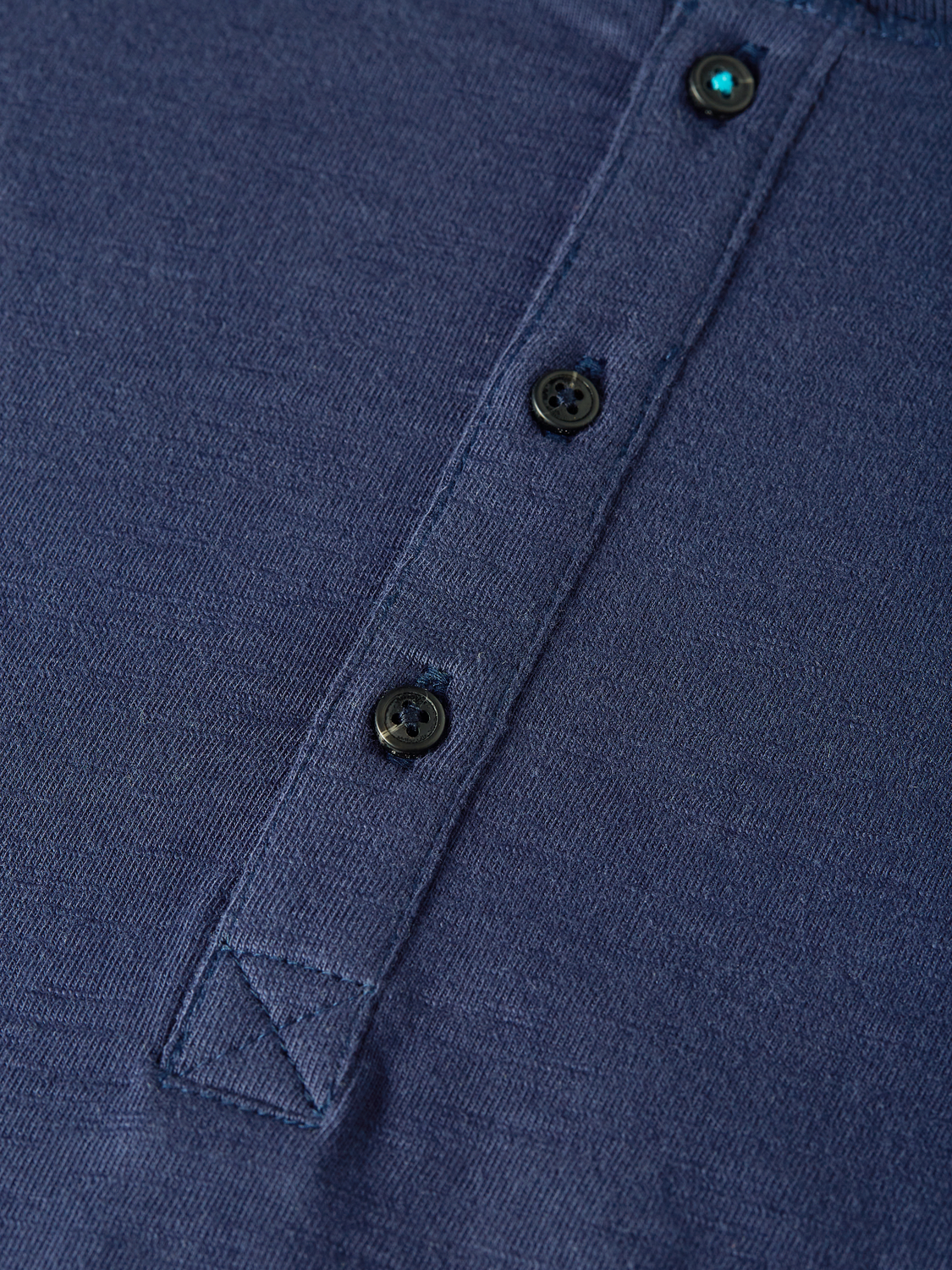 Long sleeve Scotch & Soda Slub Henley t-shirt with buttoned neckline and textured fabric, displayed on a neutral background.