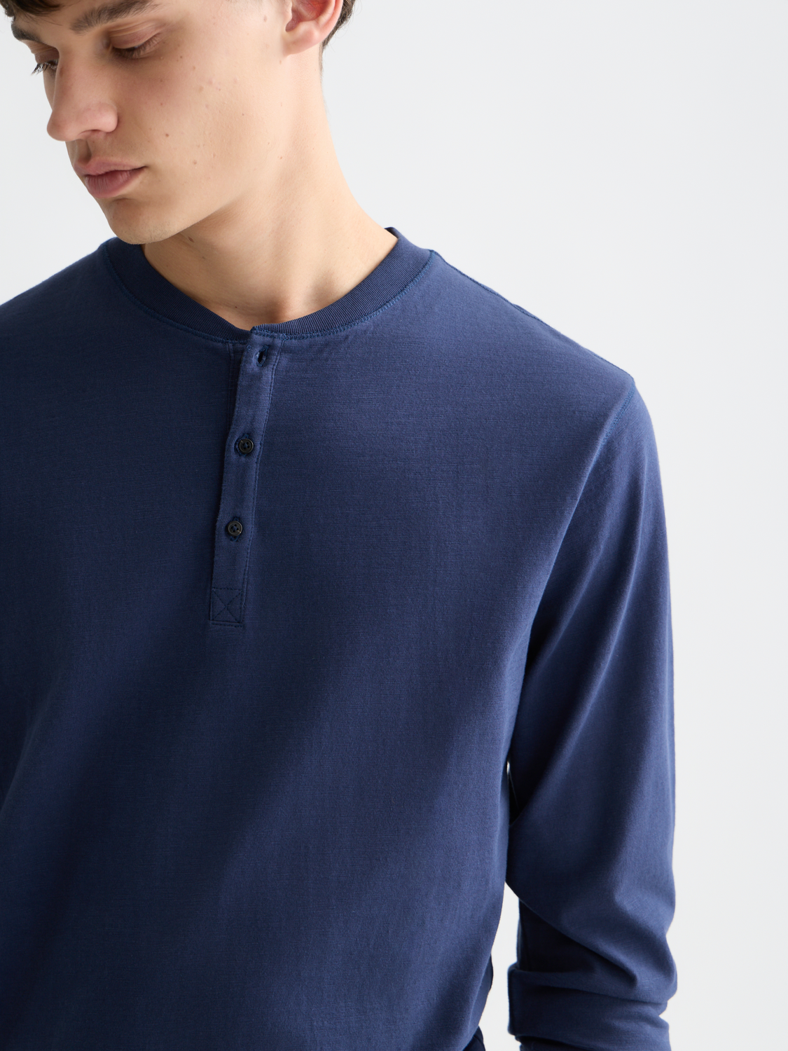 Long sleeve Slub Henley t-shirt by Scotch & Soda featuring a textured fabric and buttoned neckline.