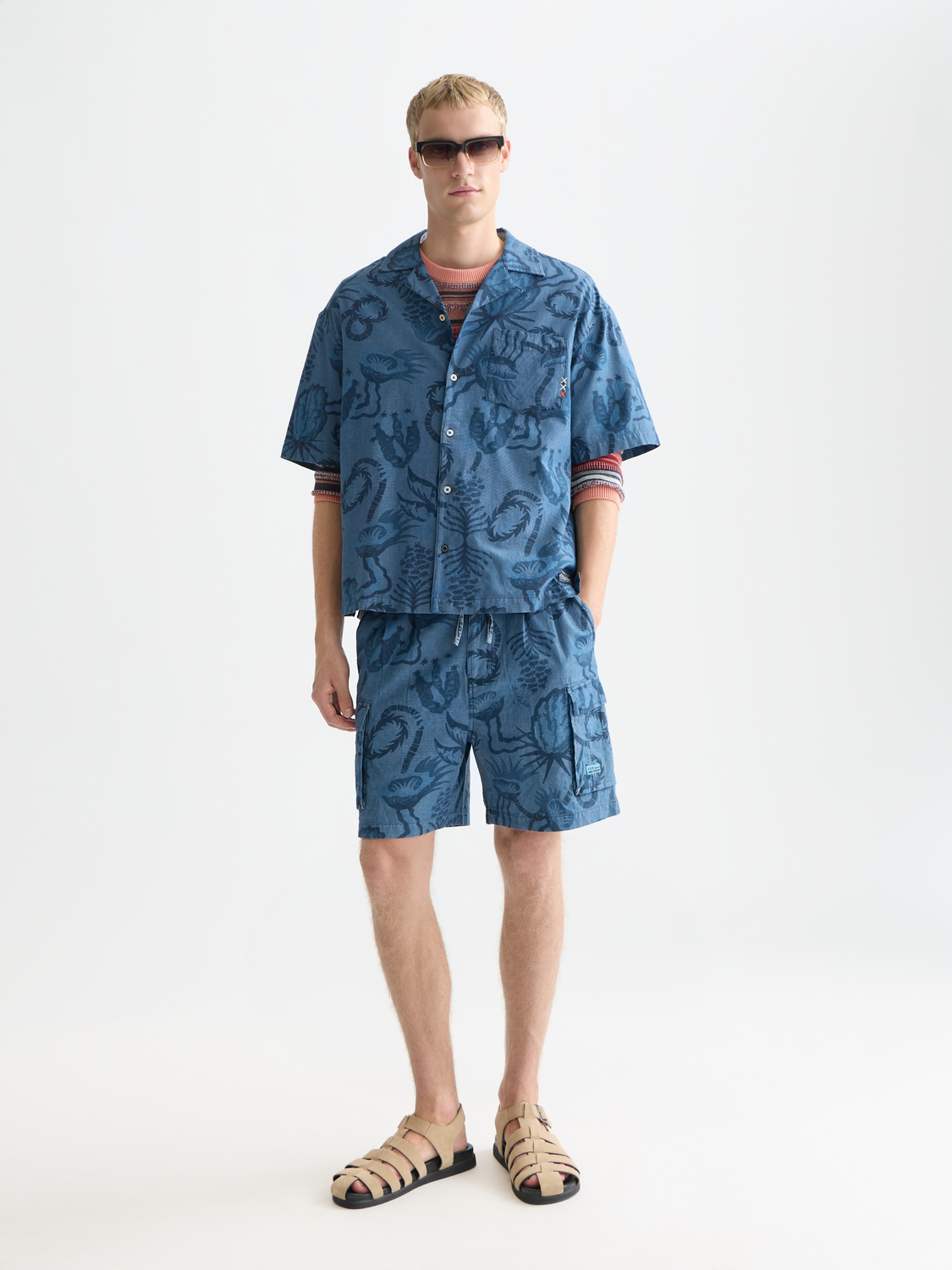 Denim cargo shorts by Scotch & Soda featuring printed design, front view, casual style, and functional pockets.