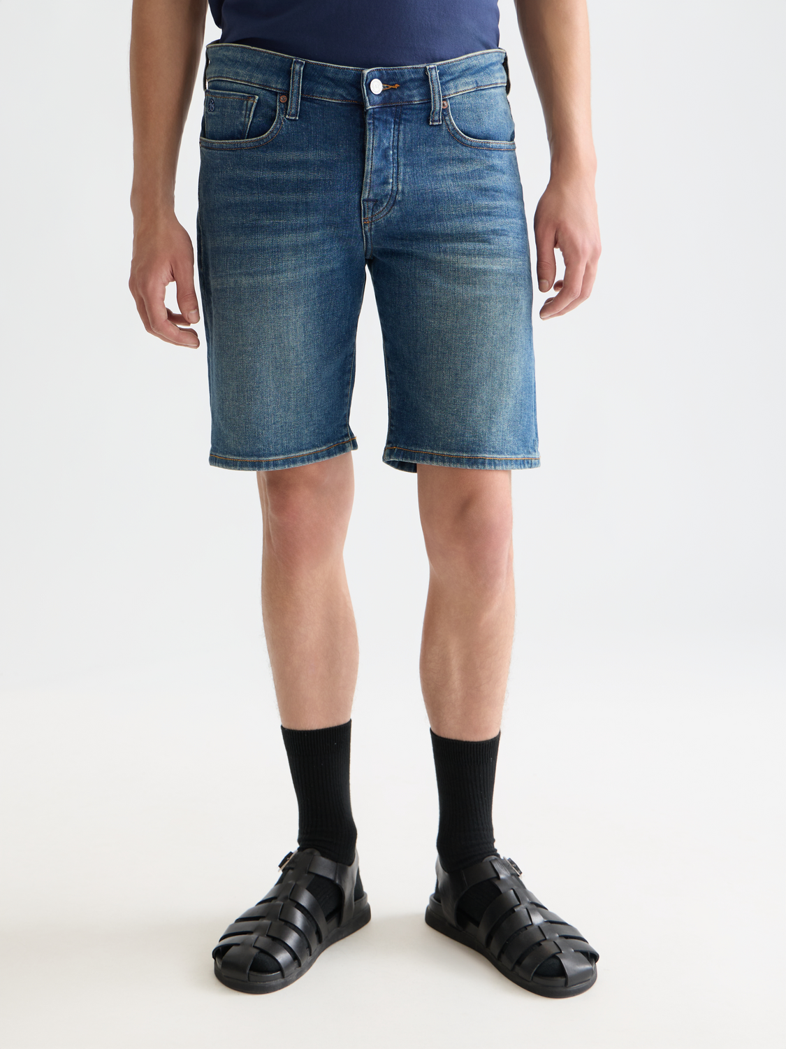 Scotch & Soda Ralston denim shorts with rolled cuffs, classic five-pocket design, light wash denim, front view.