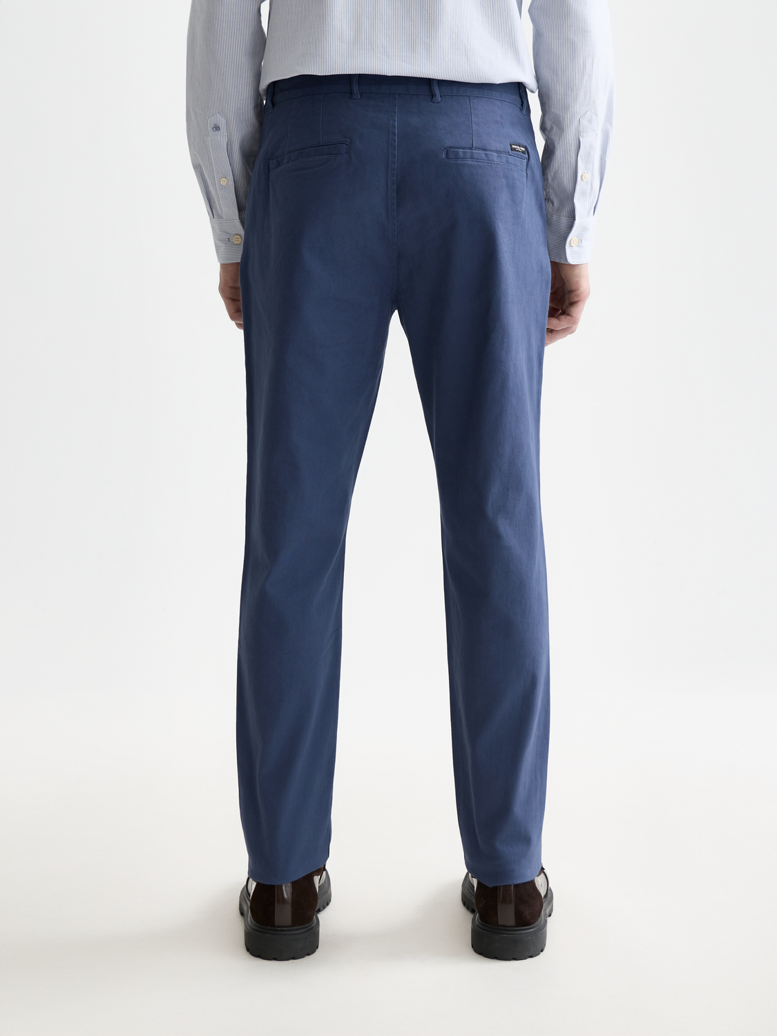 Scotch & Soda men's Stuart slim-fit chinos in dark color, showcasing tailored pants with a clean waistband and front pockets.