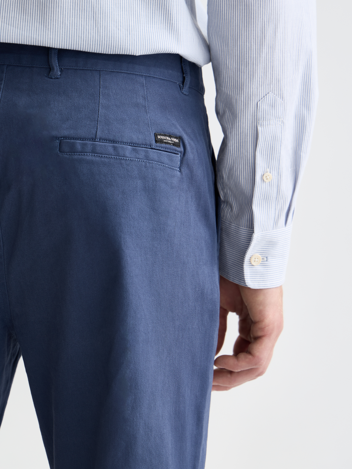 Scotch & Soda Stuart slim-fit chinos in neutral fabric, featuring classic design and tailored fit, displayed on a plain background.