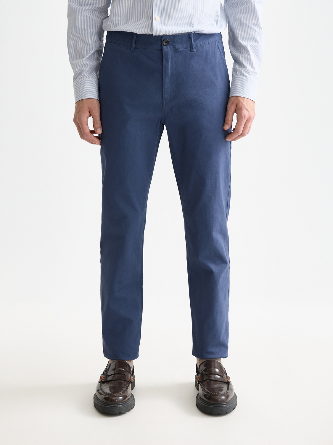 Slim-fit Stuart chinos pants by Scotch & Soda in a neutral color, displayed on a model showcasing front view.