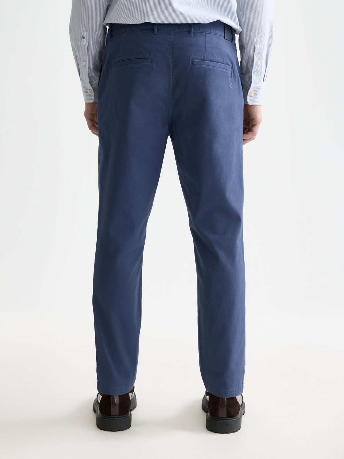 Dark gray Scotch & Soda Drift tapered chinos pants shown from the back, featuring a relaxed fit and subtle stitching details.