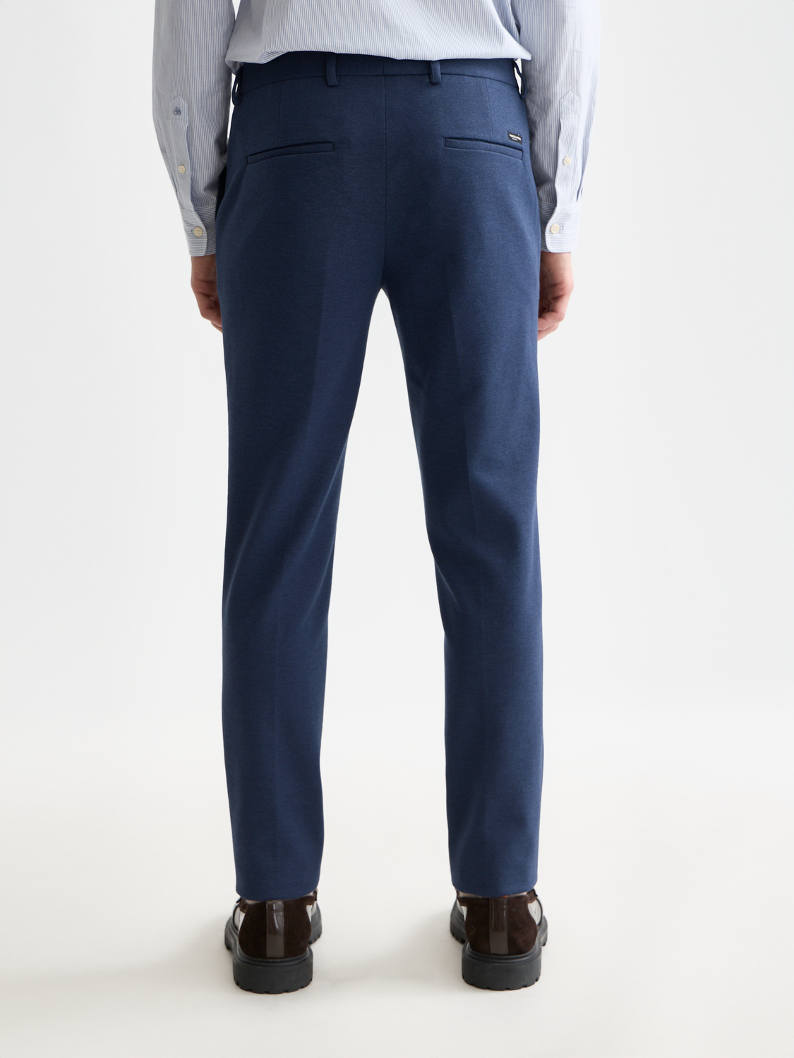 SCOTCH & SODA Mott super slim-fit chinos pants in dark denim, back view showing tailored fit and clean stitching.