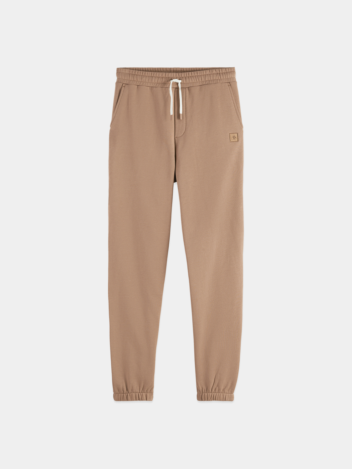 SCOTCH & SODA logo badge sweatpants showing the branded logo patch on the front, made of soft, comfortable fabric.