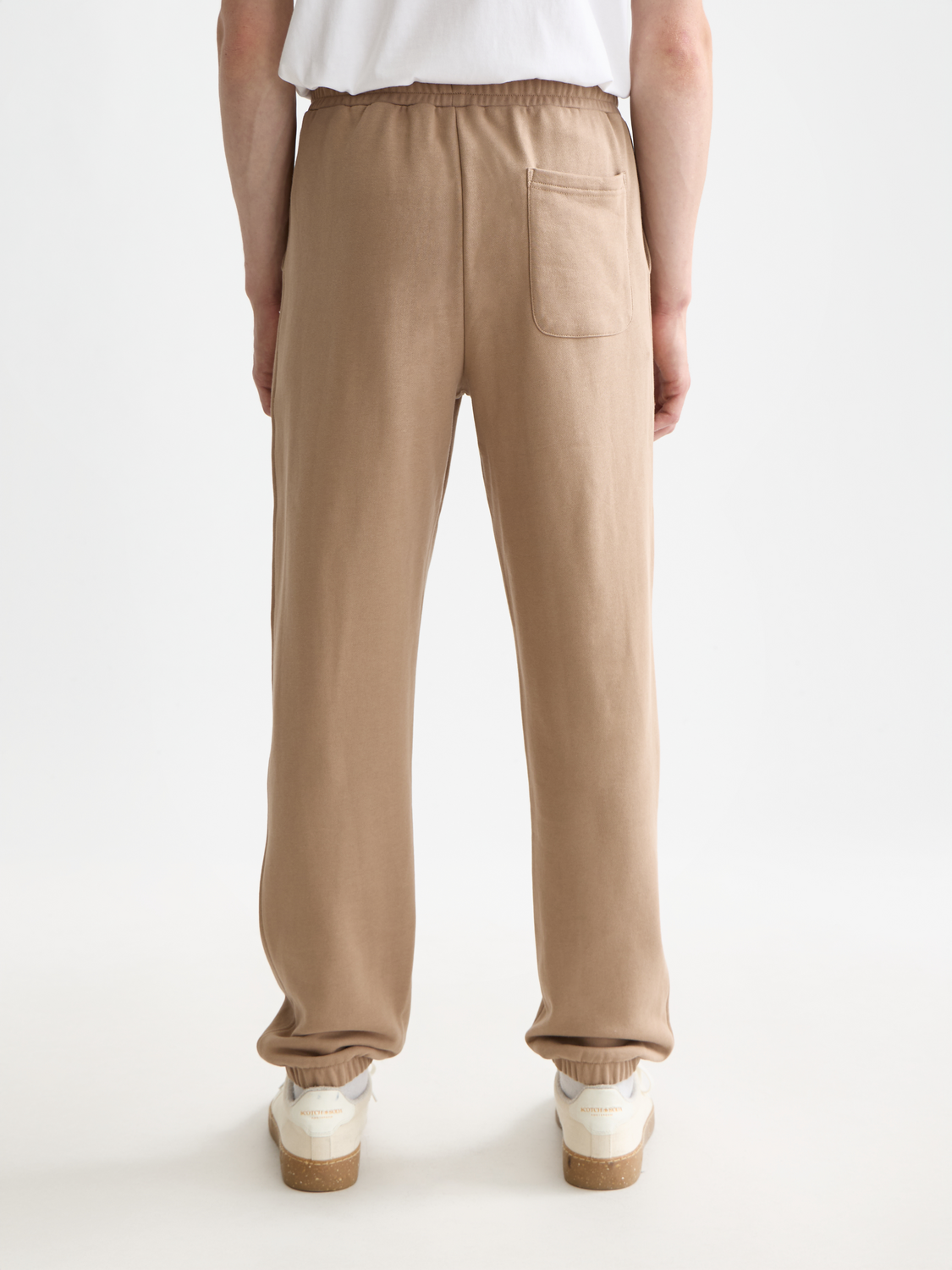Black sweatpants with a logo badge from Scotch & Soda, featuring a relaxed fit and elastic waistband.
