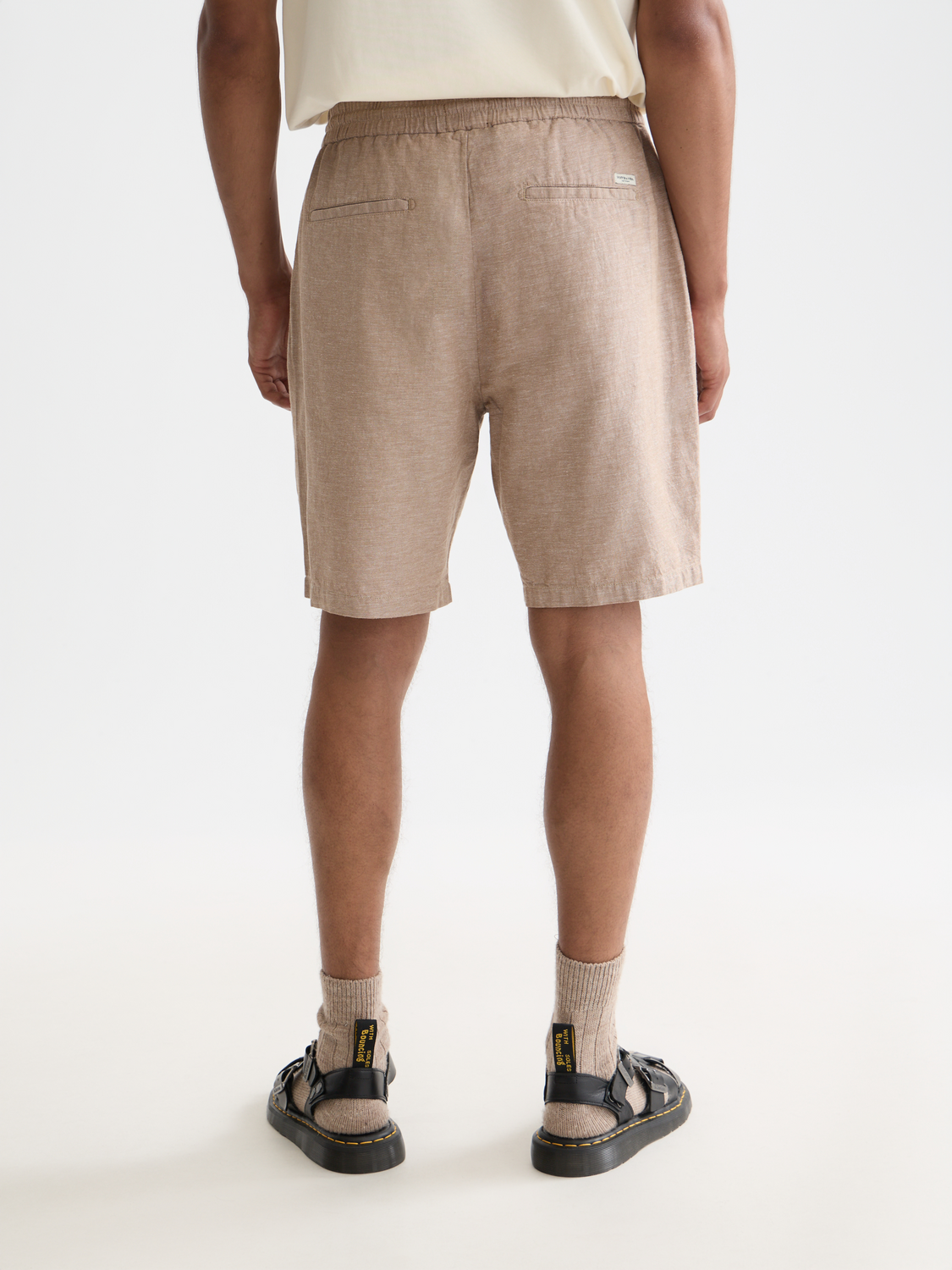 SCOTCH & SODA Fave cotton-linen shorts, back view showing relaxed fit and natural fabric texture.