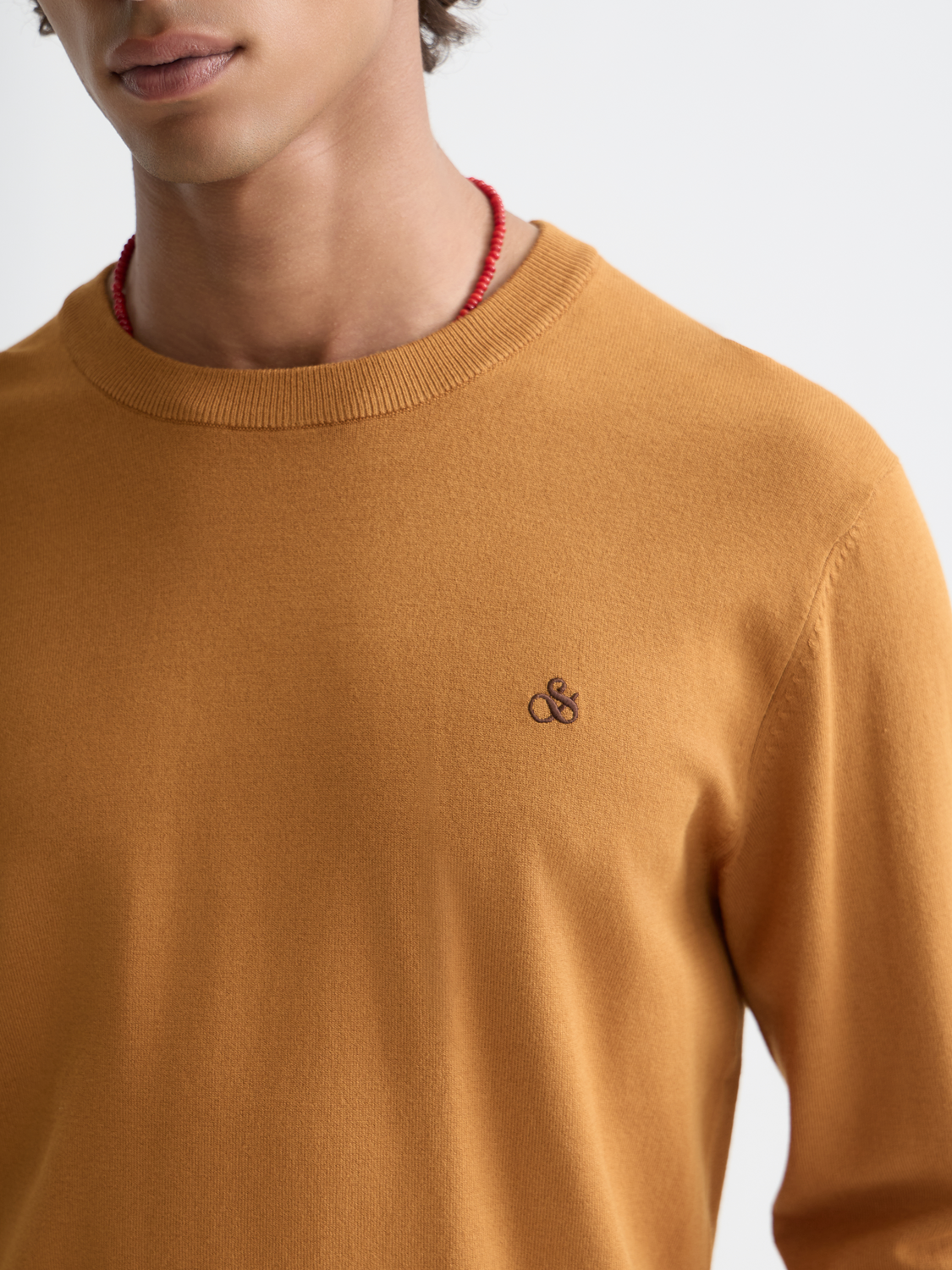 SCOTCH & SODA viscose knitwear pullover in a cozy, stylish design, shown in a close-up image highlighting the fabric texture.
