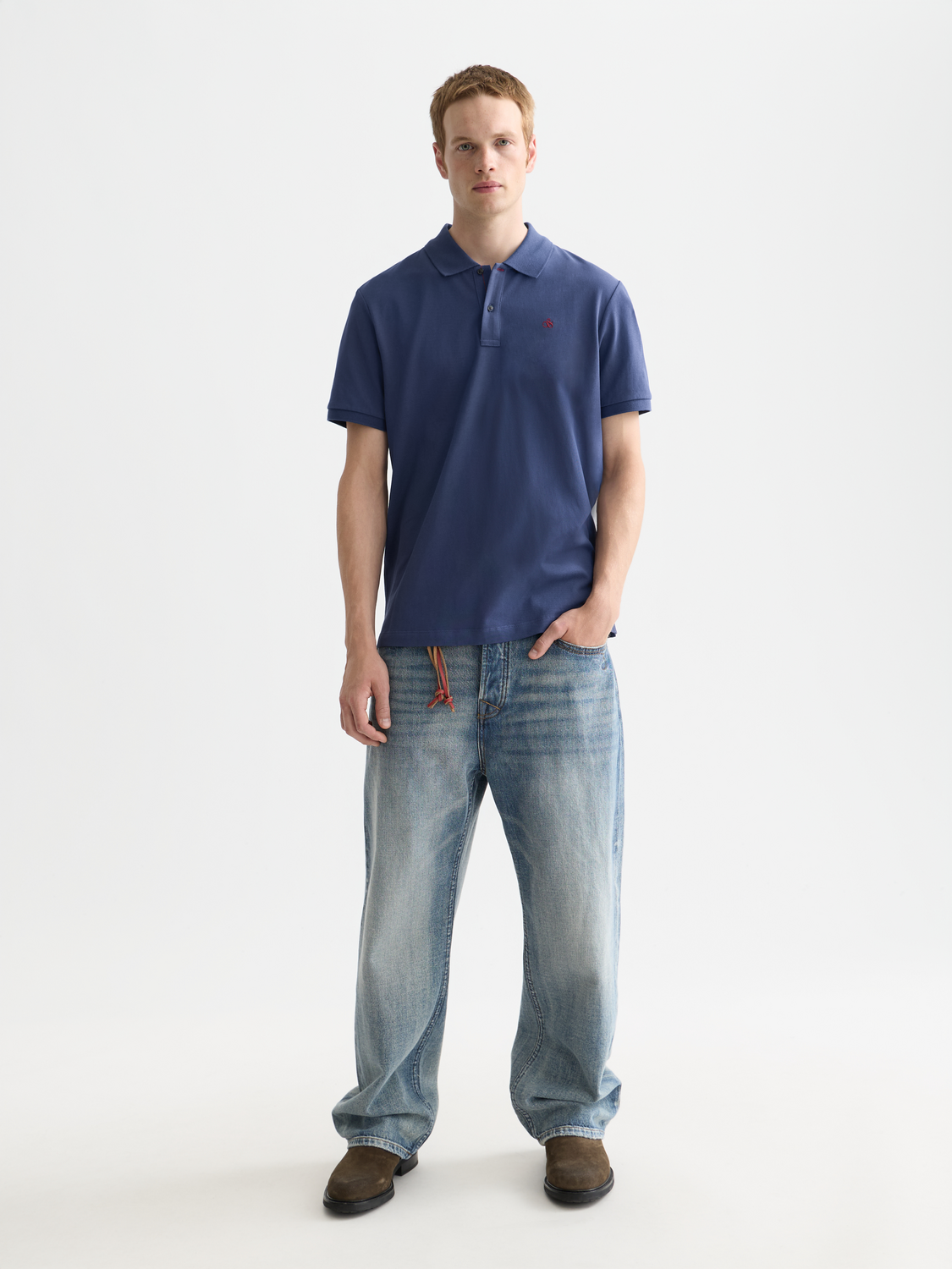 Navy Scotch & Soda logo pique polo shirt with a classic collar and short sleeves, displayed on a plain background.