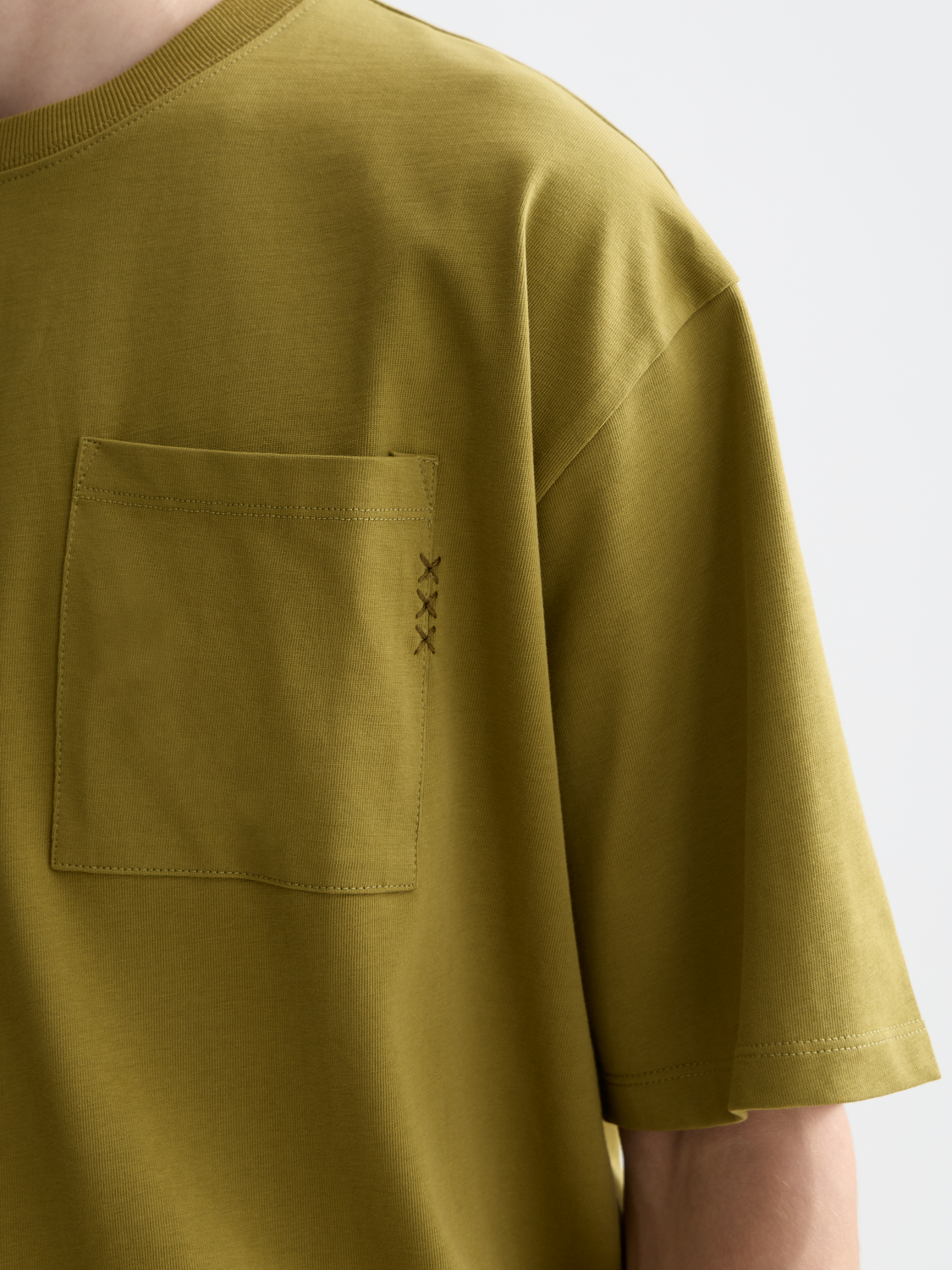 Light blue Scotch & Soda short-sleeve chest pocket t-shirt with a relaxed fit and minimal design.