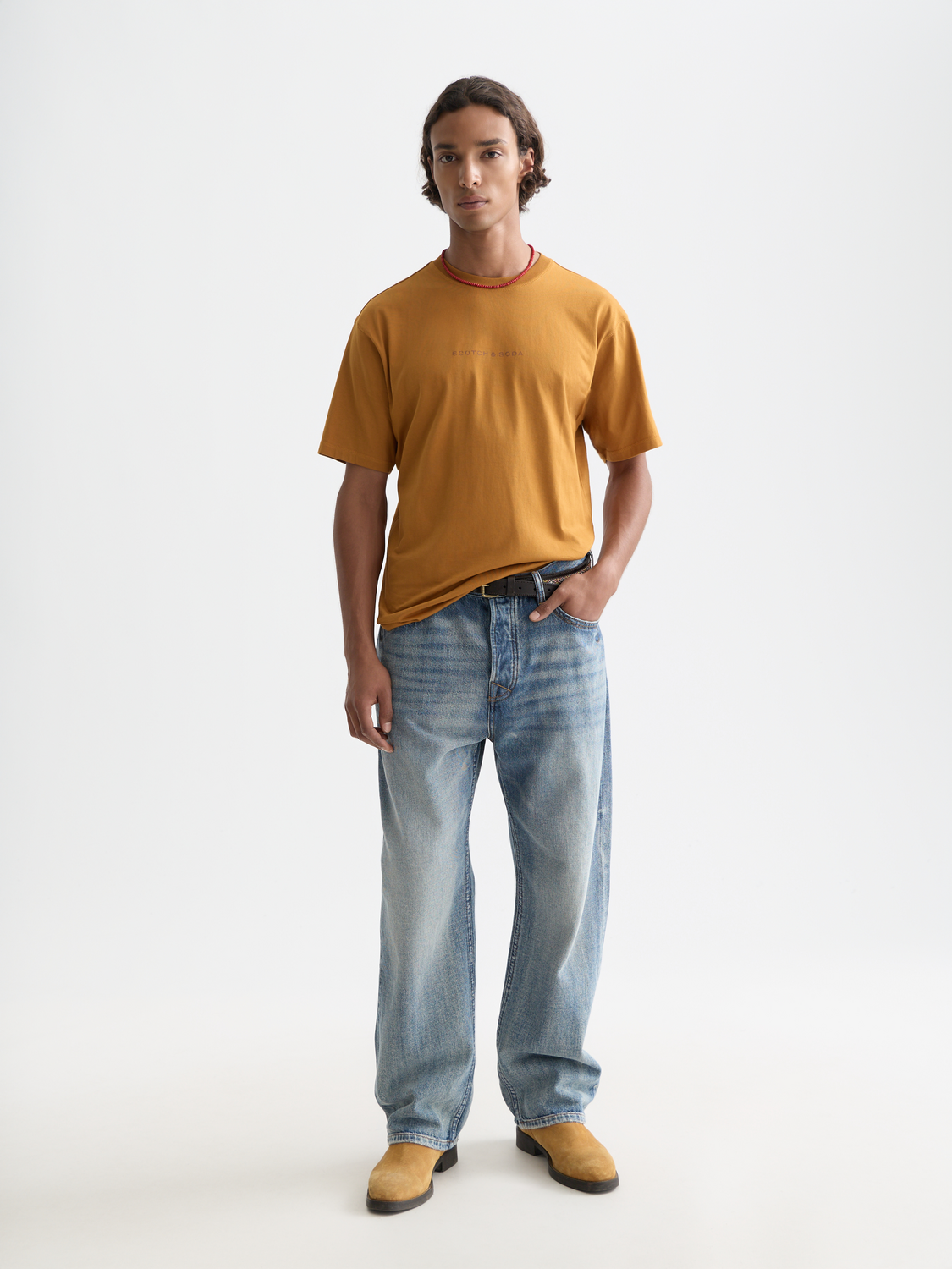 White short-sleeve T-shirt by Scotch & Soda with logo print on front, casual men's fashion tee.