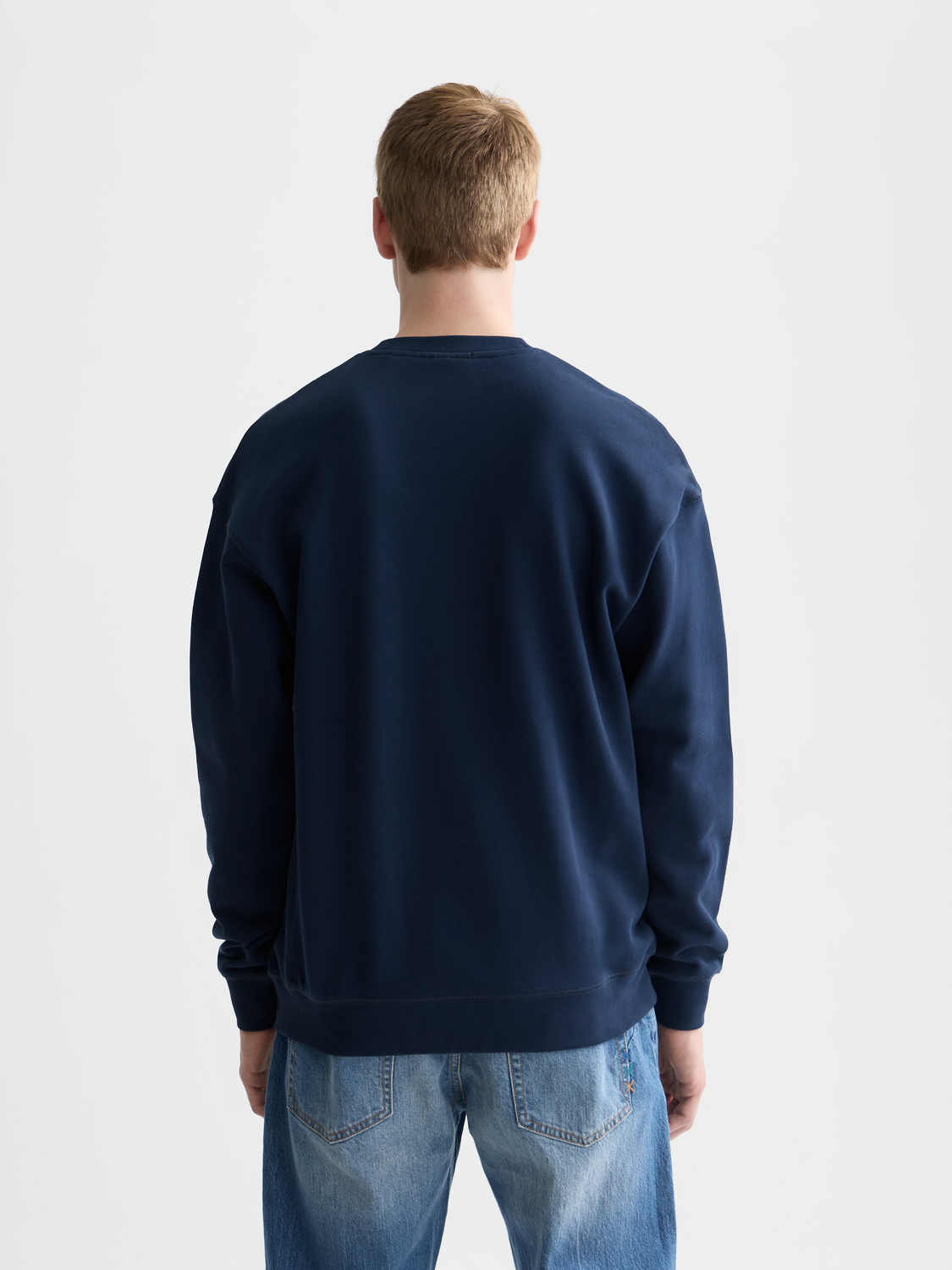 Black Scotch & Soda logo sweatshirt with front graphic and long sleeves, casual style, on a plain background.