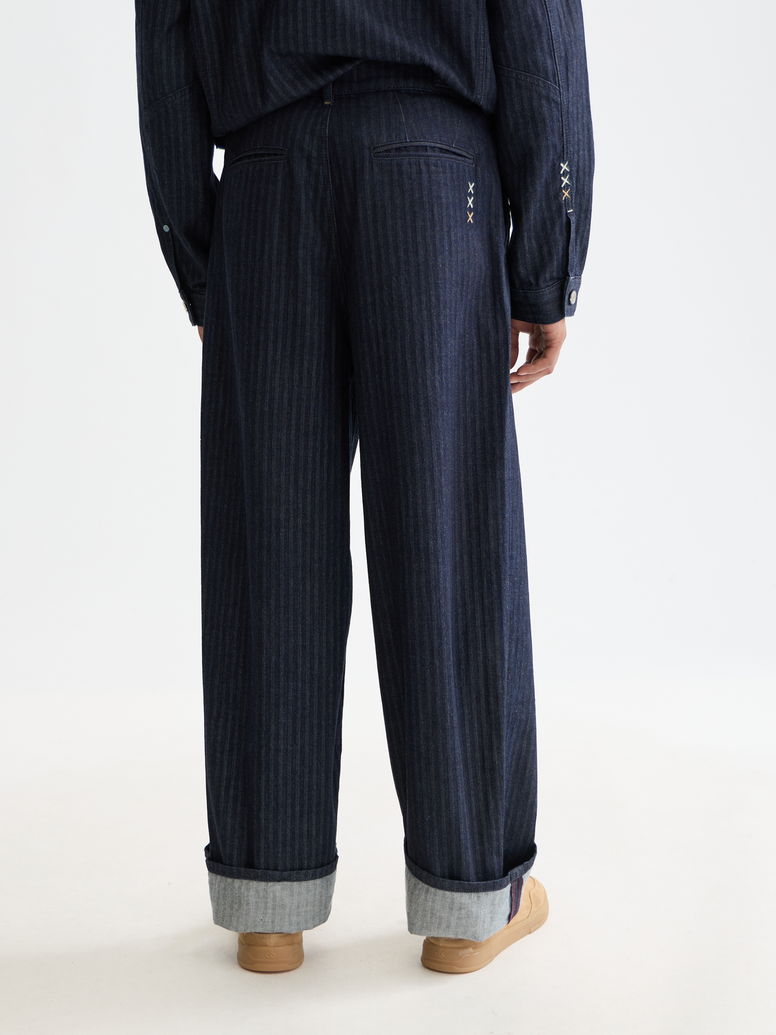 Back view of loose-fit denim jeans by Scotch & Soda, showcasing relaxed fit and classic denim fabric.