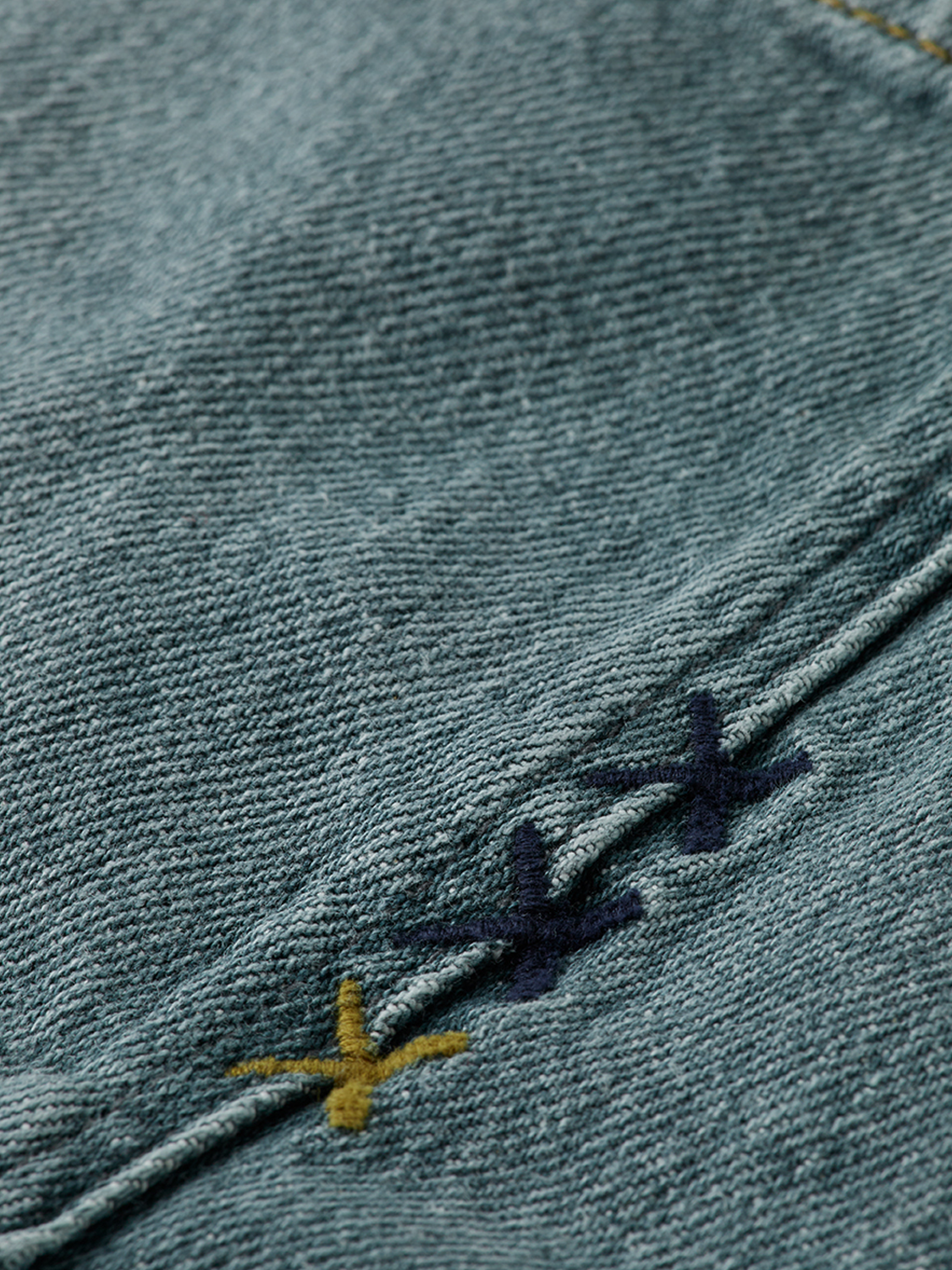 SCOTCH & SODA Dean tapered denim jeans showing a fitted style with classic blue wash and subtle stitching details.