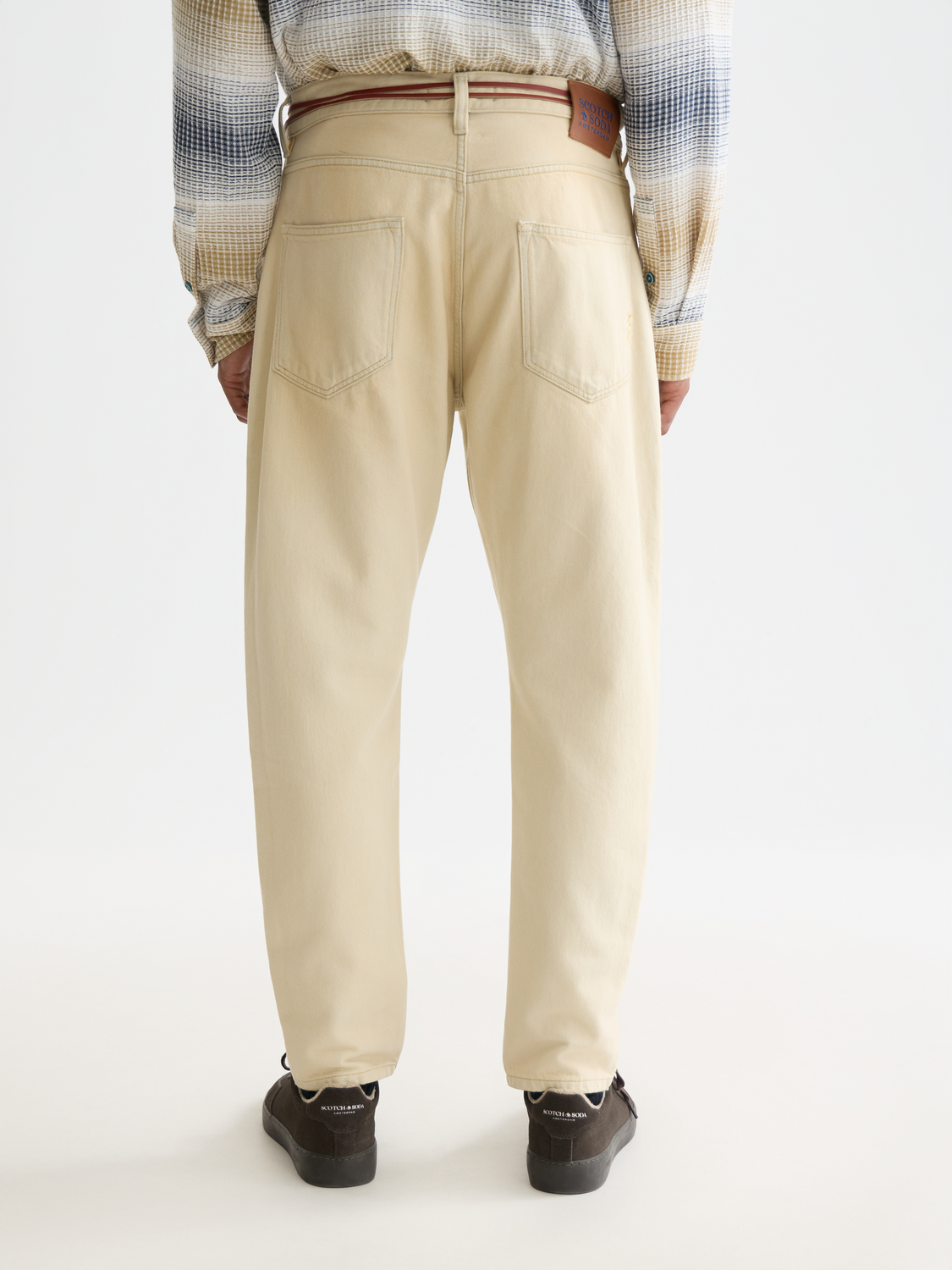 Dark blue Dean tapered denim jeans by Scotch & Soda with back pockets and subtle fading detail.