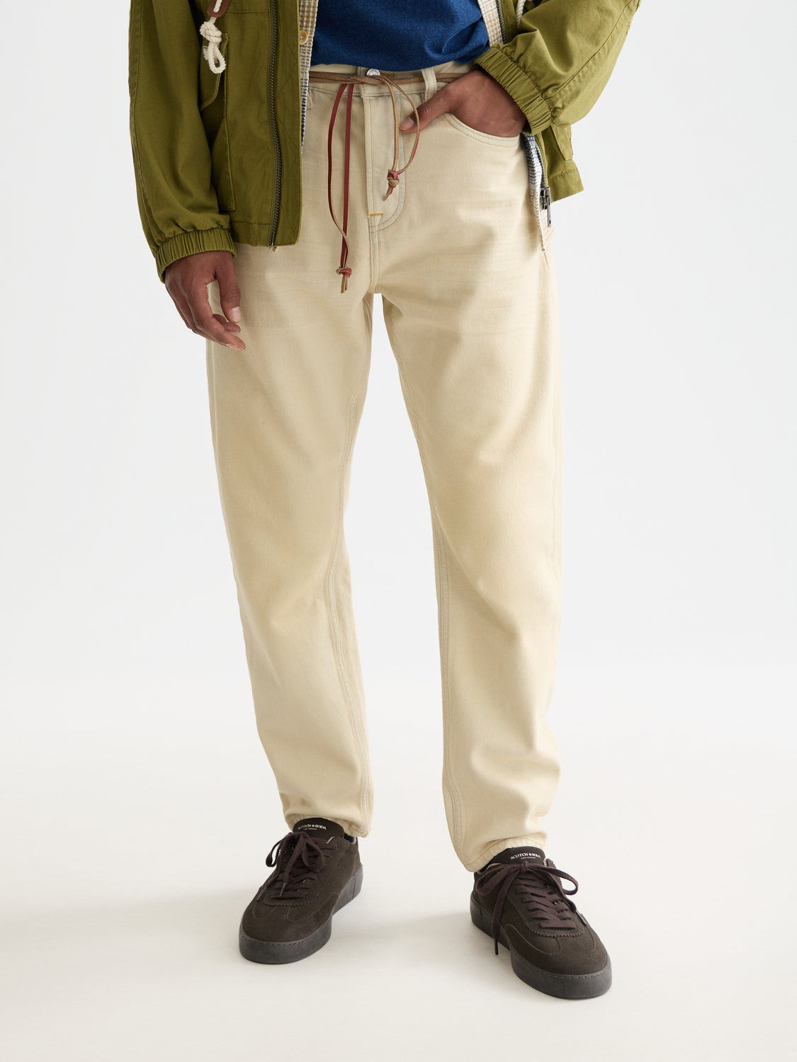 SCOTCH & SODA Dean tapered denim jeans with a dark wash and slim fit, shown on a neutral background.