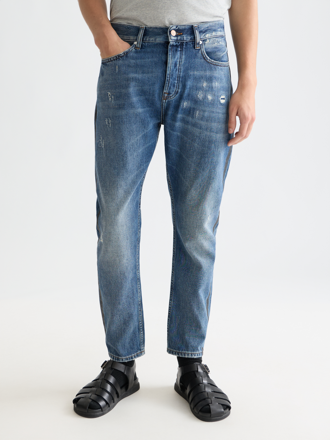 Scotch & Soda Dean tapered denim jeans with classic wash, front view showing slim fit and detailed stitching.