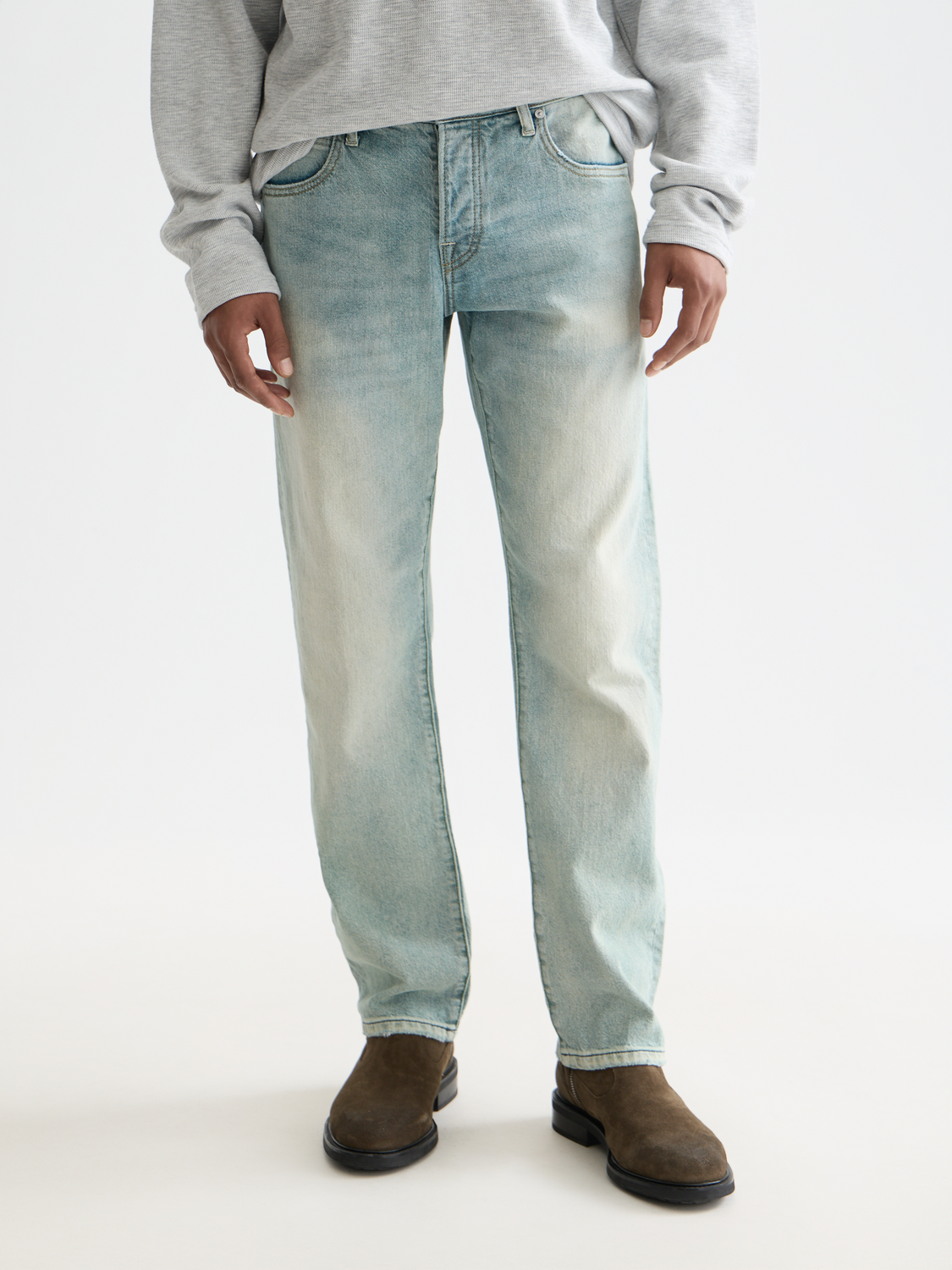 SCOTCH & SODA Zee straight-fit denim jeans displayed on a hanger with front view and zipper closure.