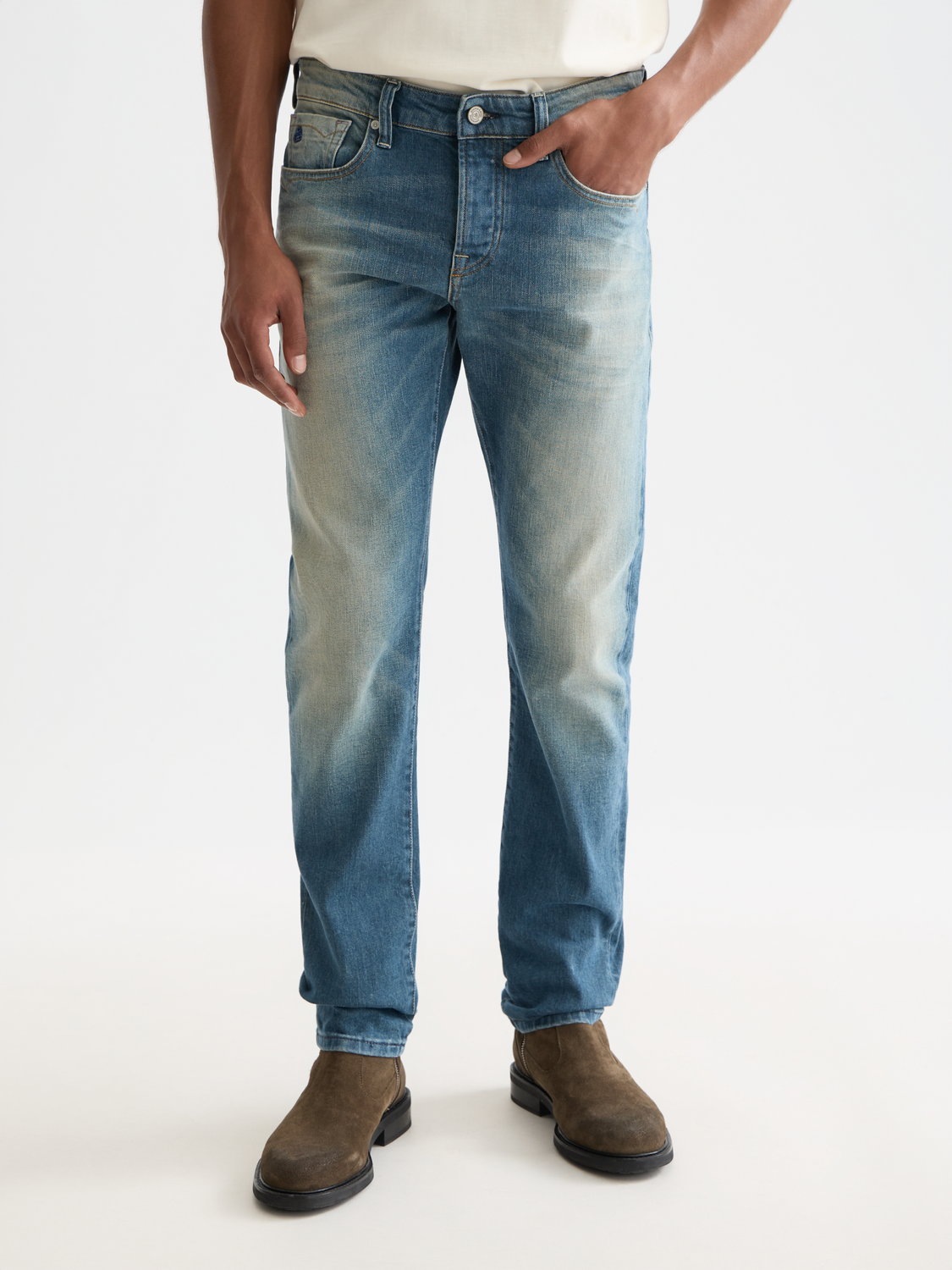 Slim-fit Ralston denim jeans by Scotch & Soda, shown in dark wash with classic five-pocket design and subtle stitching details.