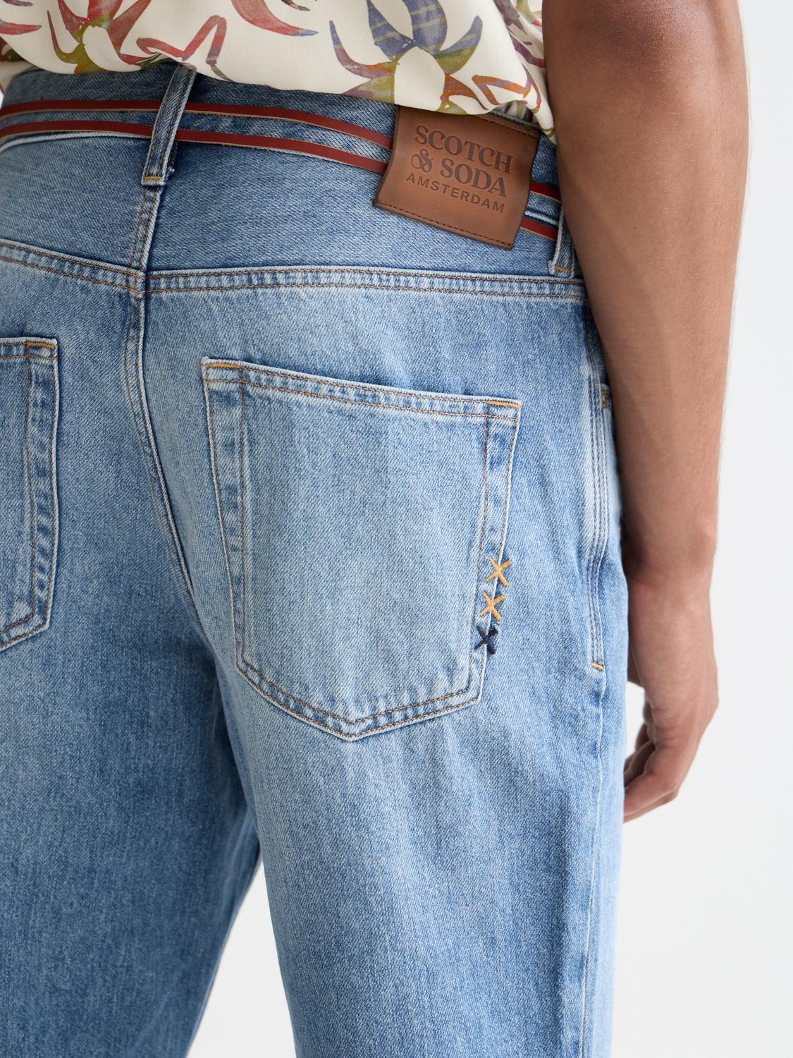 Scotch & Soda wide-fit denim jeans with a relaxed silhouette and classic five-pocket design, shown on a model.