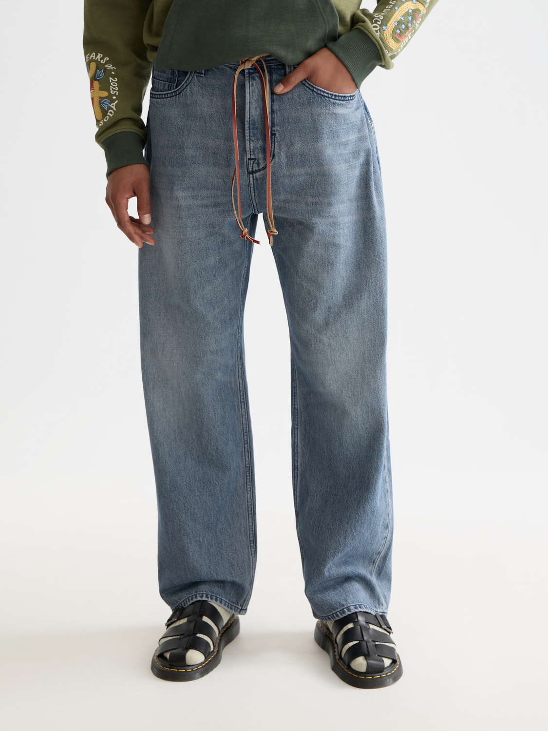 Scotch & Soda loose-fit denim jeans with a relaxed style, featuring classic five-pocket design and faded blue wash.