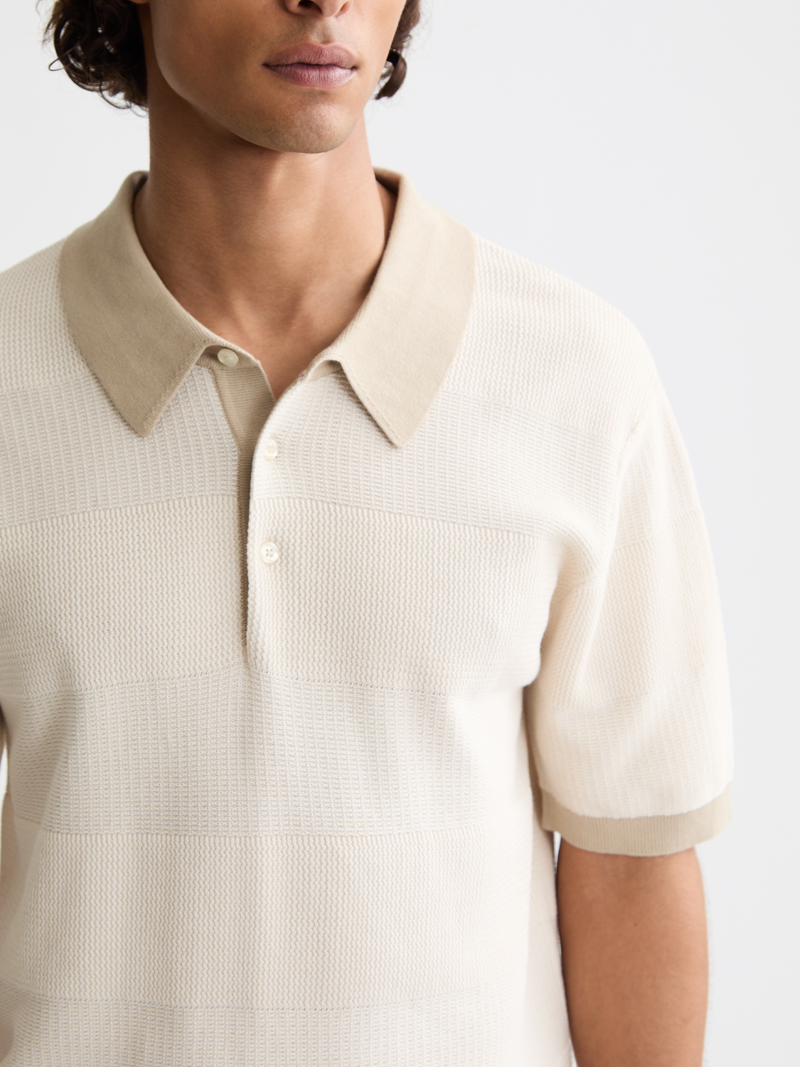 Knitted tonal polo shirt by Scotch & Soda featuring a classic collar and short sleeves, in a soft, textured fabric.
