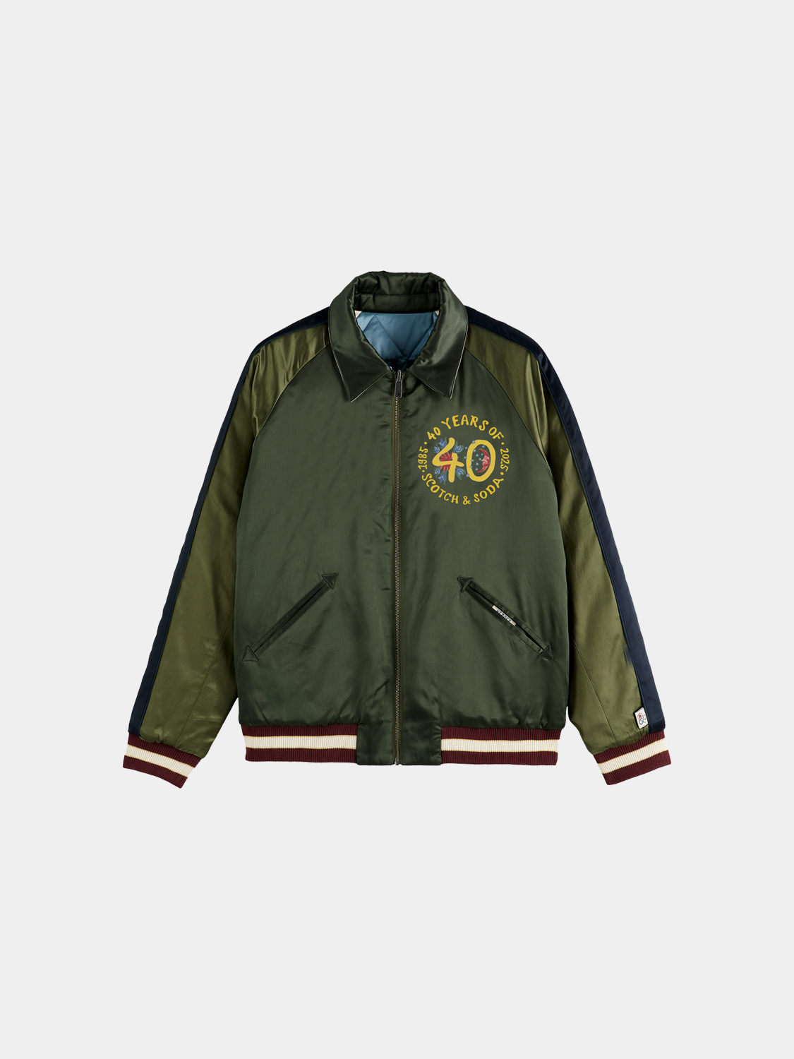 Reversible souvenir bomber jacket by Scotch & Soda featuring colorful patchwork design and casual fit.