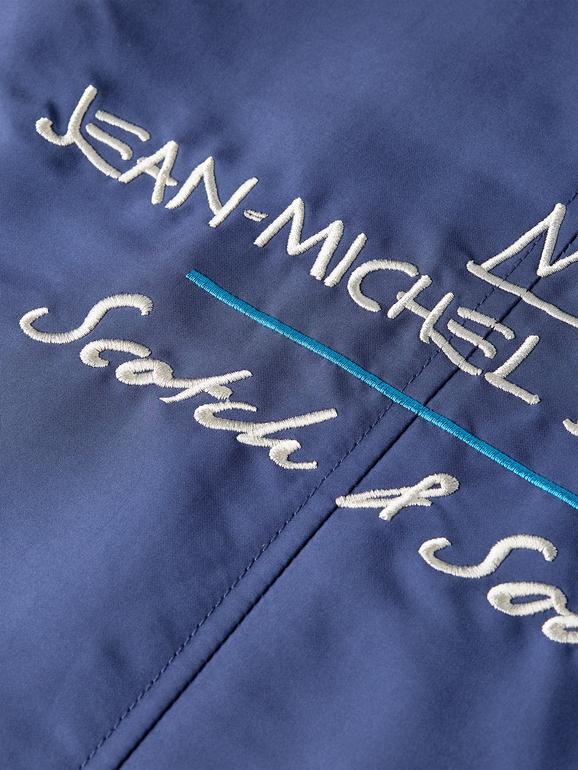 SCOTCH & SODA S&S x Basquiat souvenir jacket with vibrant artwork and classic bomber style, front view showing detailed embroidery.