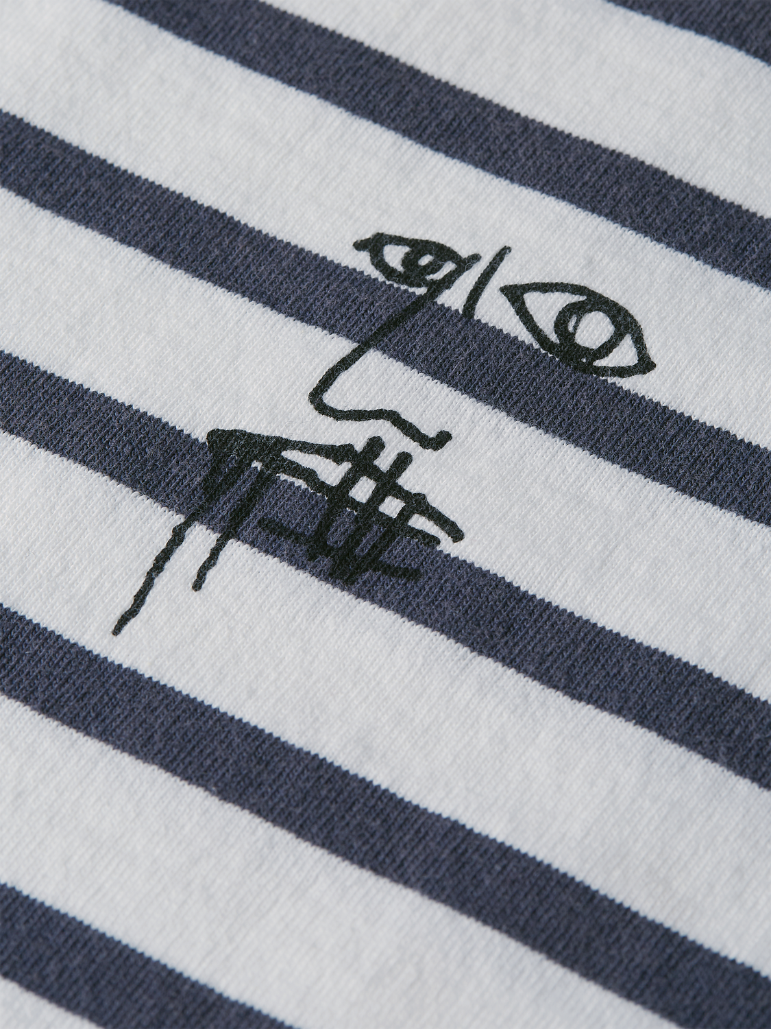 Long sleeve Breton striped t-shirt by Scotch & Soda featuring S&S x Basquiat design with classic navy and white stripes.