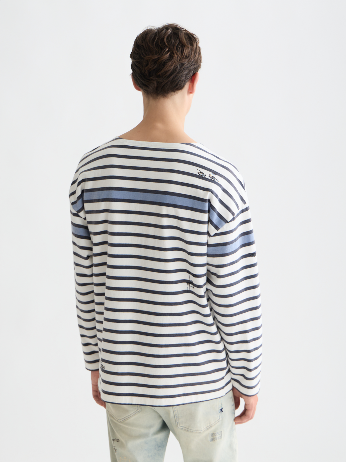 Long-sleeve Breton striped t-shirt by Scotch & Soda featuring artwork-inspired design from S&S x Basquiat collection.