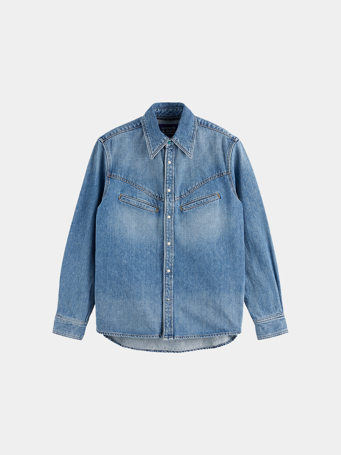 Long-sleeve washed denim shirt by Scotch & Soda, showing a casual fit with classic collar and button front.