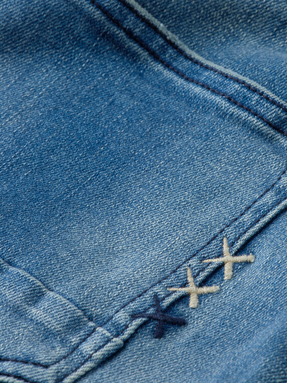 Scotch & Soda Ralston slim-fit denim jeans showing a classic blue wash with five-pocket styling and belt loops.