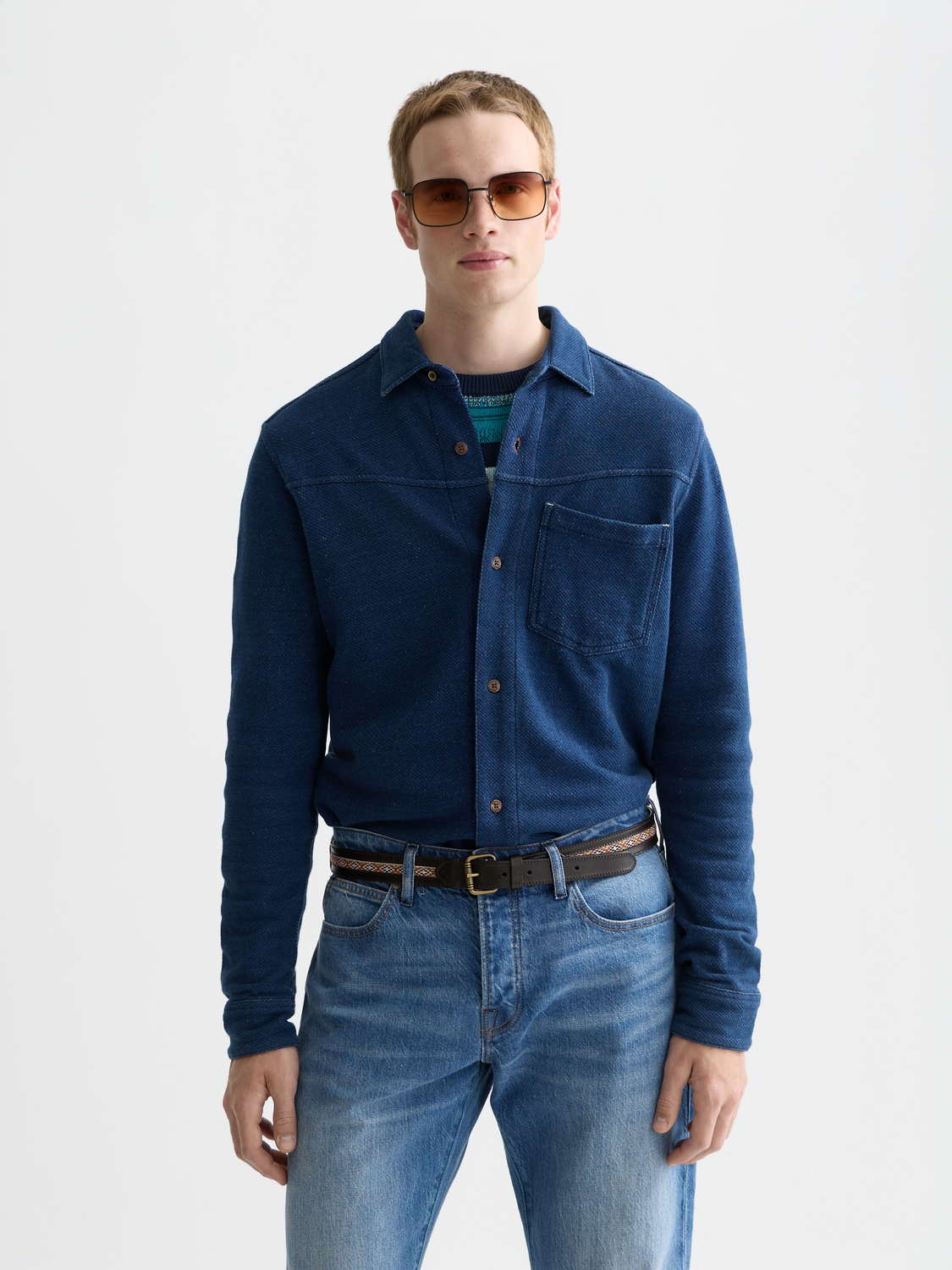 Washed indigo Scotch & Soda long-sleeve shirt with button front and casual fit, displayed on a hanger.