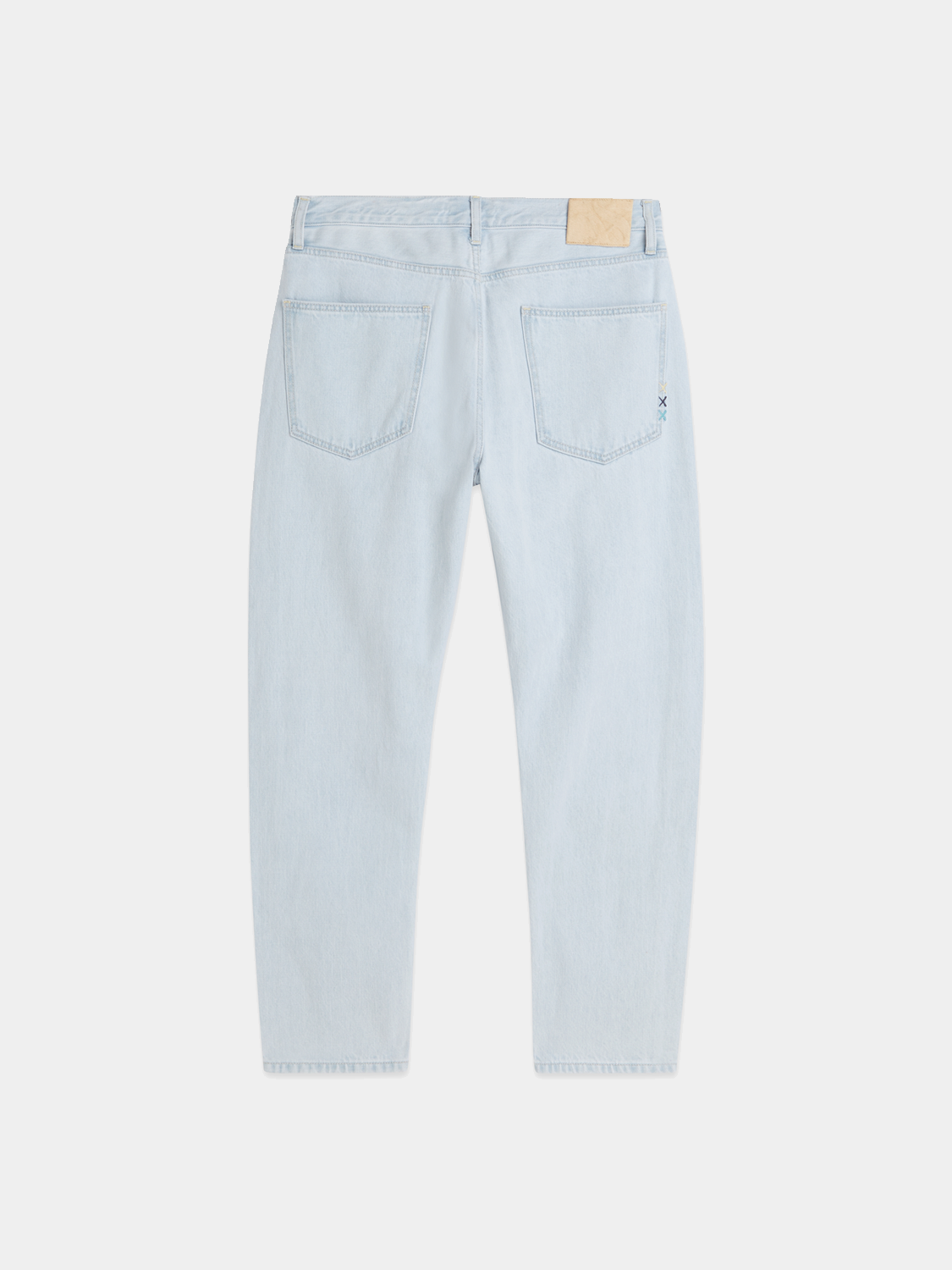 Dark blue Scotch & Soda Dean tapered jeans made of denim, showing a close-up of the fabric and stitching details.