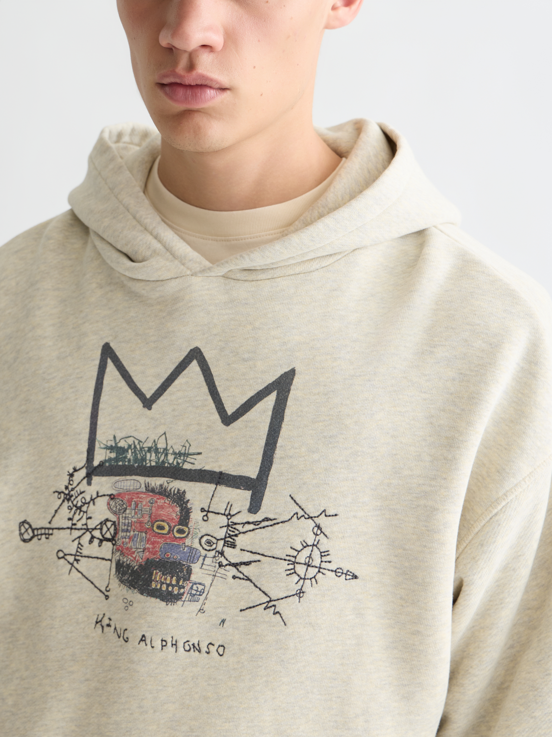 Scotch & SODA washed artwork hoodie featuring S&S x Basquiat graphic design, soft cotton fabric, casual streetwear style.