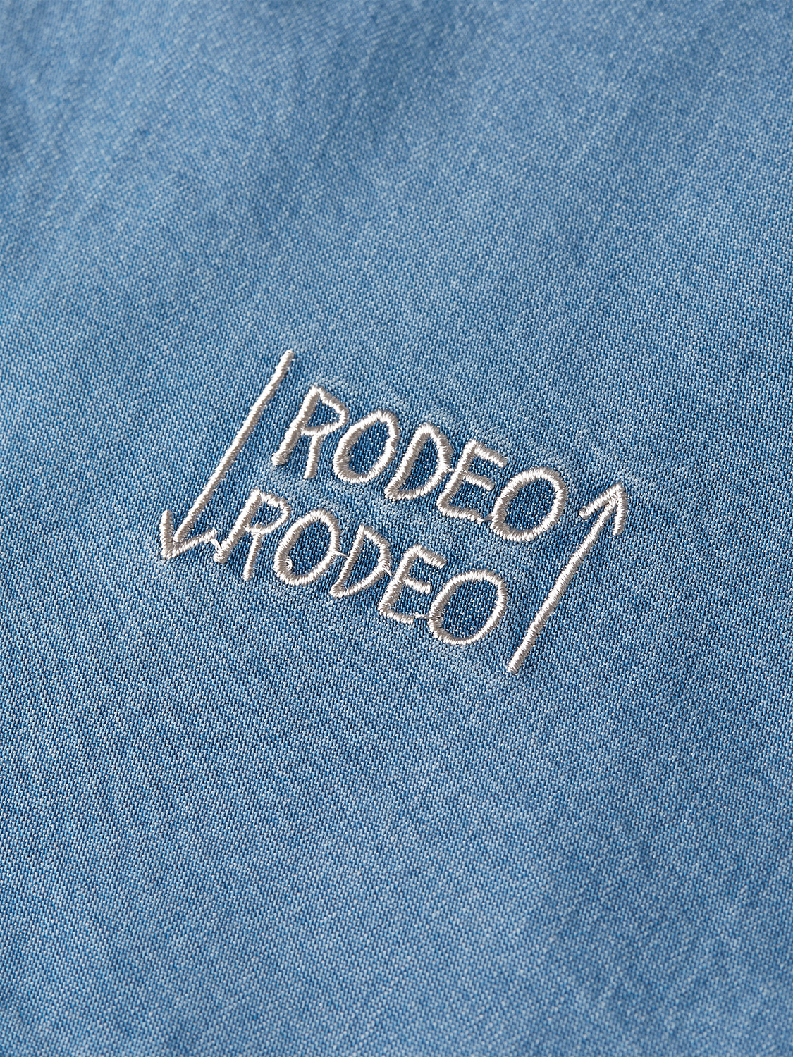 Indigo short-sleeved shirt by Scotch & Soda featuring artwork inspired by Basquiat, casual and stylish men's S/S shirt.