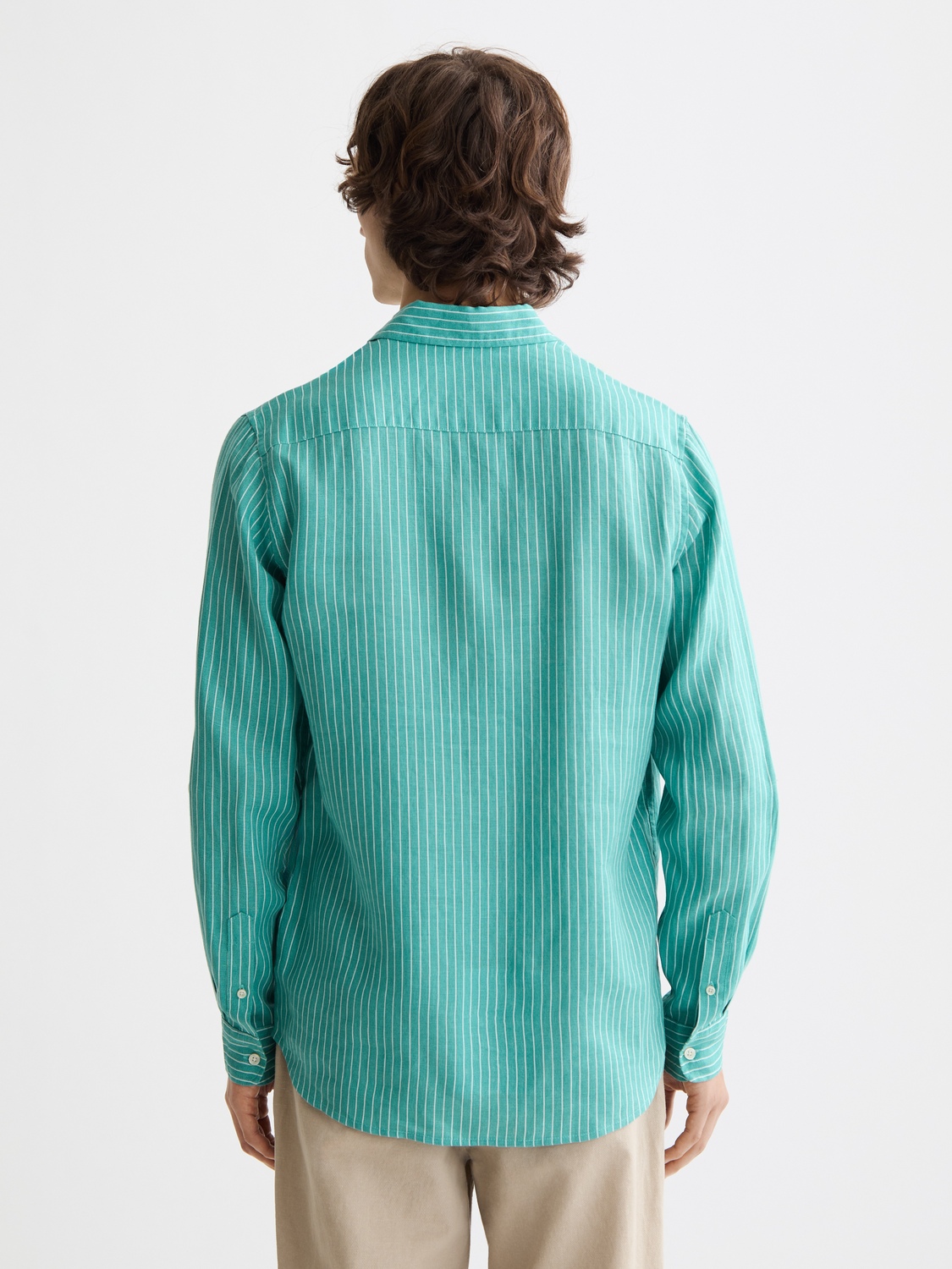 Long-sleeve striped linen shirt by Scotch & Soda, showing the back view with blue and white vertical stripes.