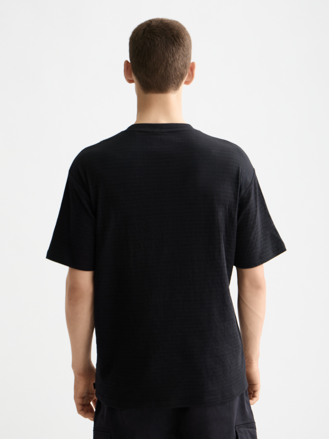 Double face pocket T-shirt from Scotch & Soda, short sleeve tee with front pockets, shown from the back.