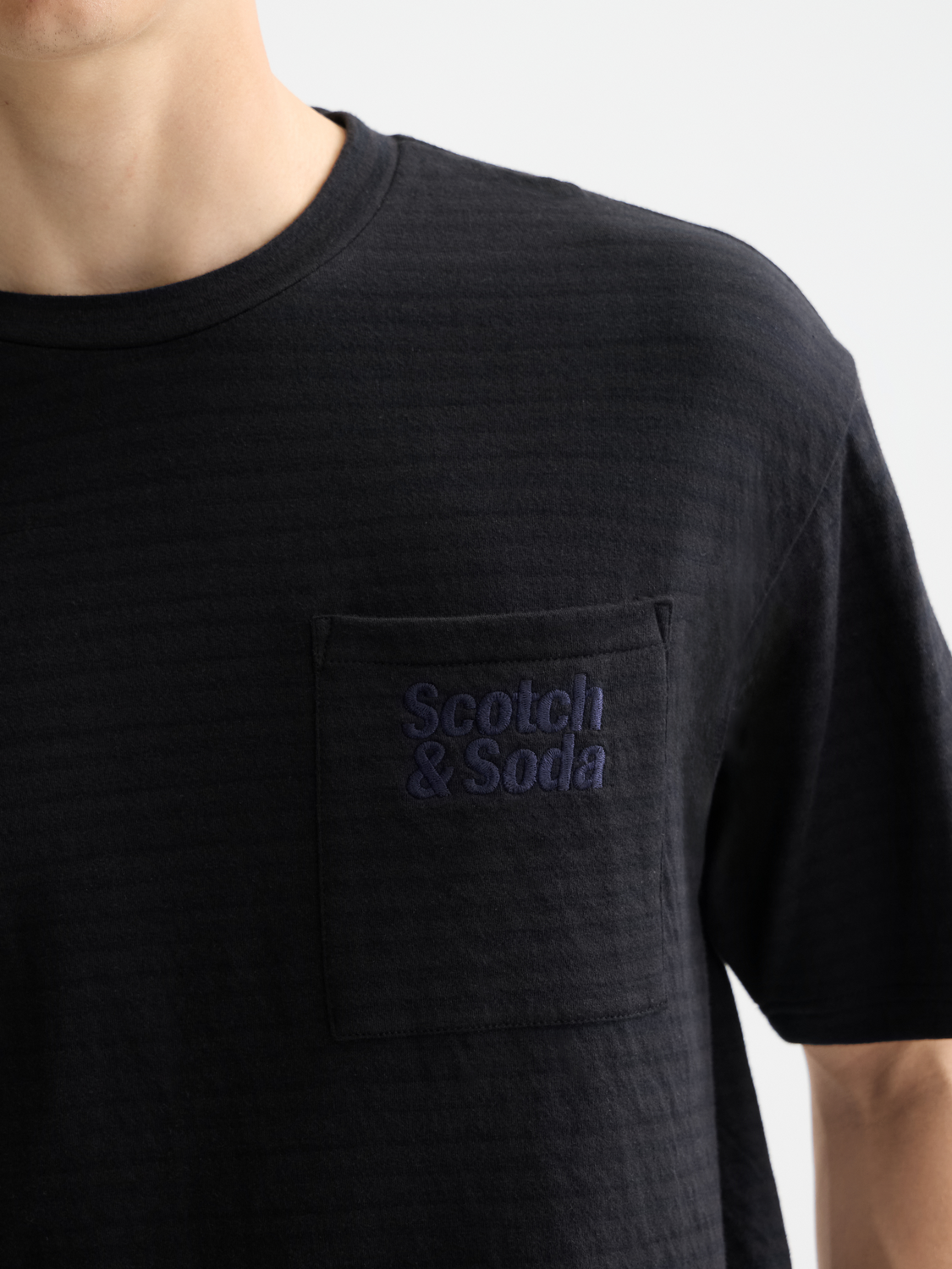 SCOTCH & SODA double face pocket short sleeve t-shirt with chest pocket, casual design, shown on a plain background.